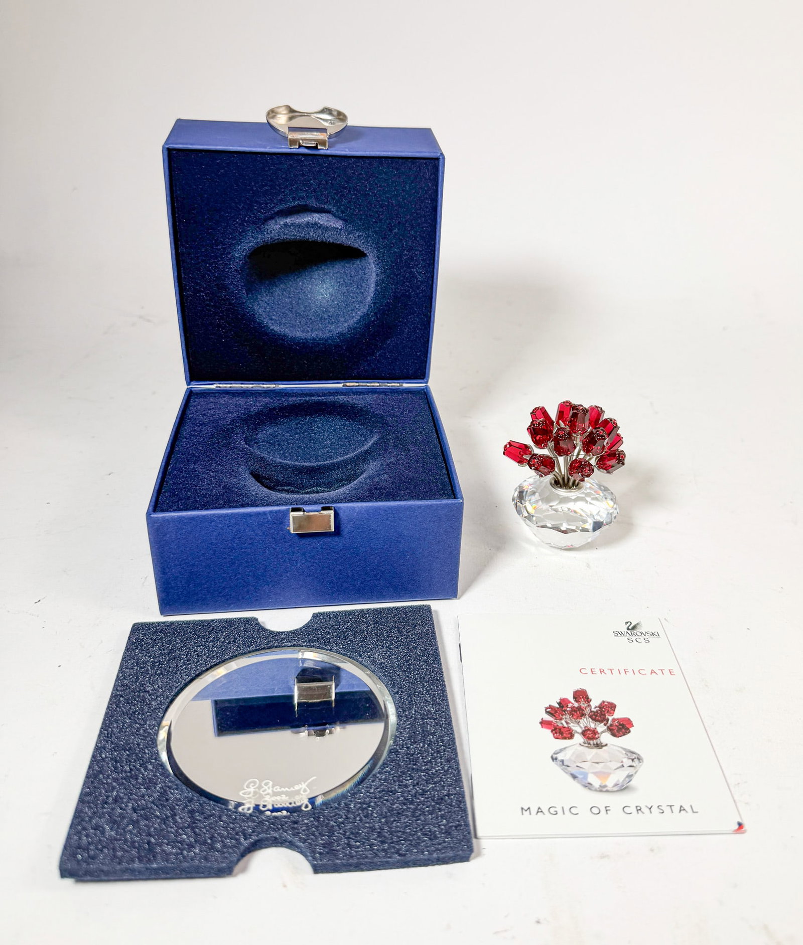 Swarovski Crystal "The Vase of Roses" IOB: Swarovski Crystal "The Vase of Roses" IOB with mirrored base Size 3" H Literature Brooks Auction – Online Auction Terms & Conditions Contact: (856) 694-2960 | info@brooks.auction READ BEFORE