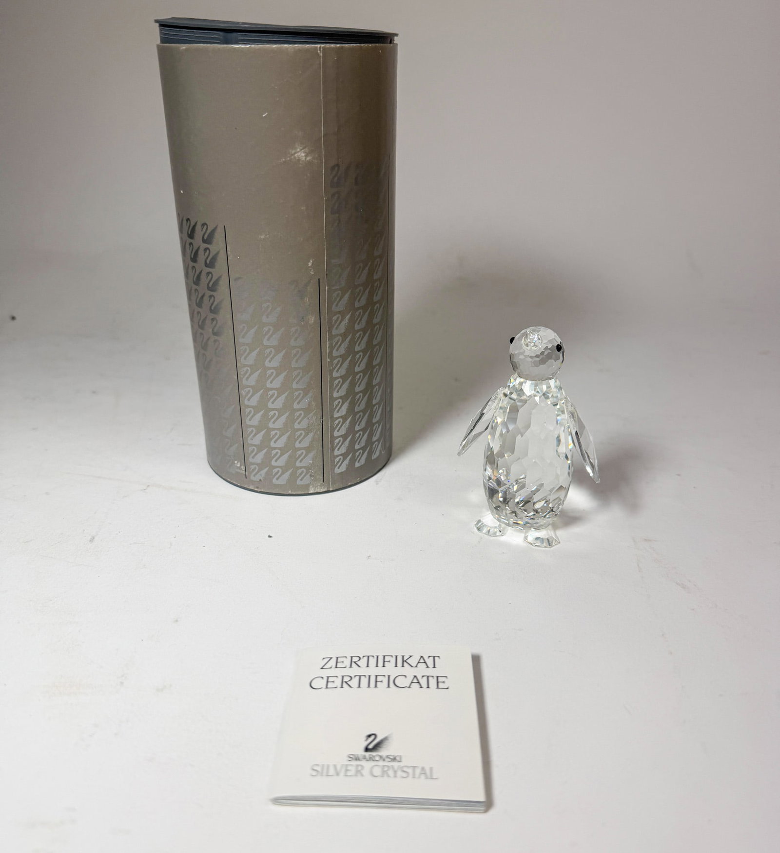 Swarovski Silver Crystal Penguin IOB: Swarovski Silver Crystal Penguin IOB Size 3.25" H Literature Brooks Auction – Online Auction Terms & Conditions Contact: (856) 694-2960 | info@brooks.auction READ BEFORE YOU BID: We want you to