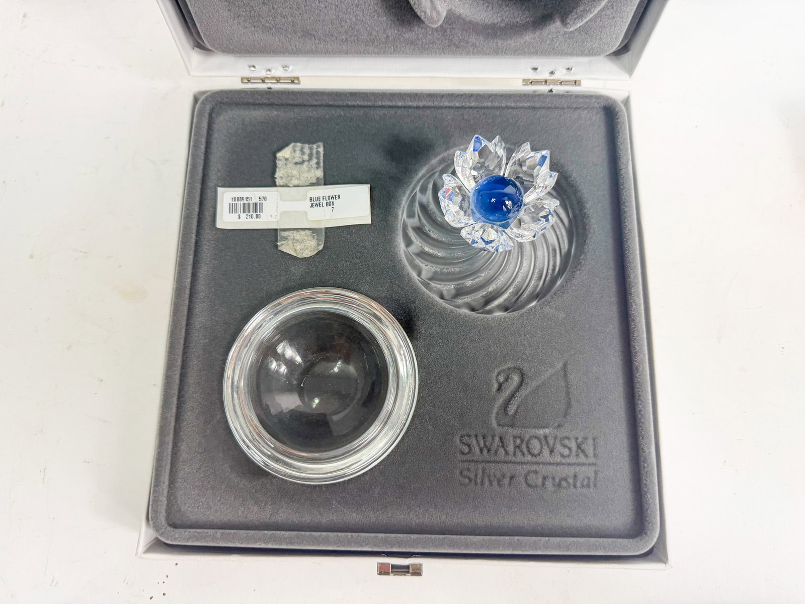 Swarovski Silver Crystal Blue Flower Jewel Box IOB: Swarovski Silver Crystal Blue Flower Jewel Box IOB, has some chipping at top Size 3" H Literature Brooks Auction – Online Auction Terms & Conditions Contact: (856) 694-2960 | info@brooks.auctio