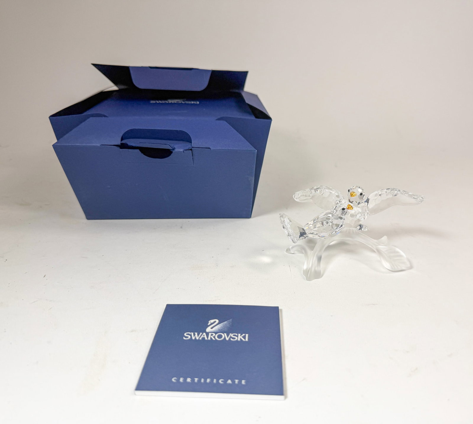 Swarovski Crystal Turtle Doves IOB: Swarovski Crystal Turtle Doves IOB Size 2.5" H Literature Brooks Auction – Online Auction Terms & Conditions Contact: (856) 694-2960 | info@brooks.auction READ BEFORE YOU BID: We want yo