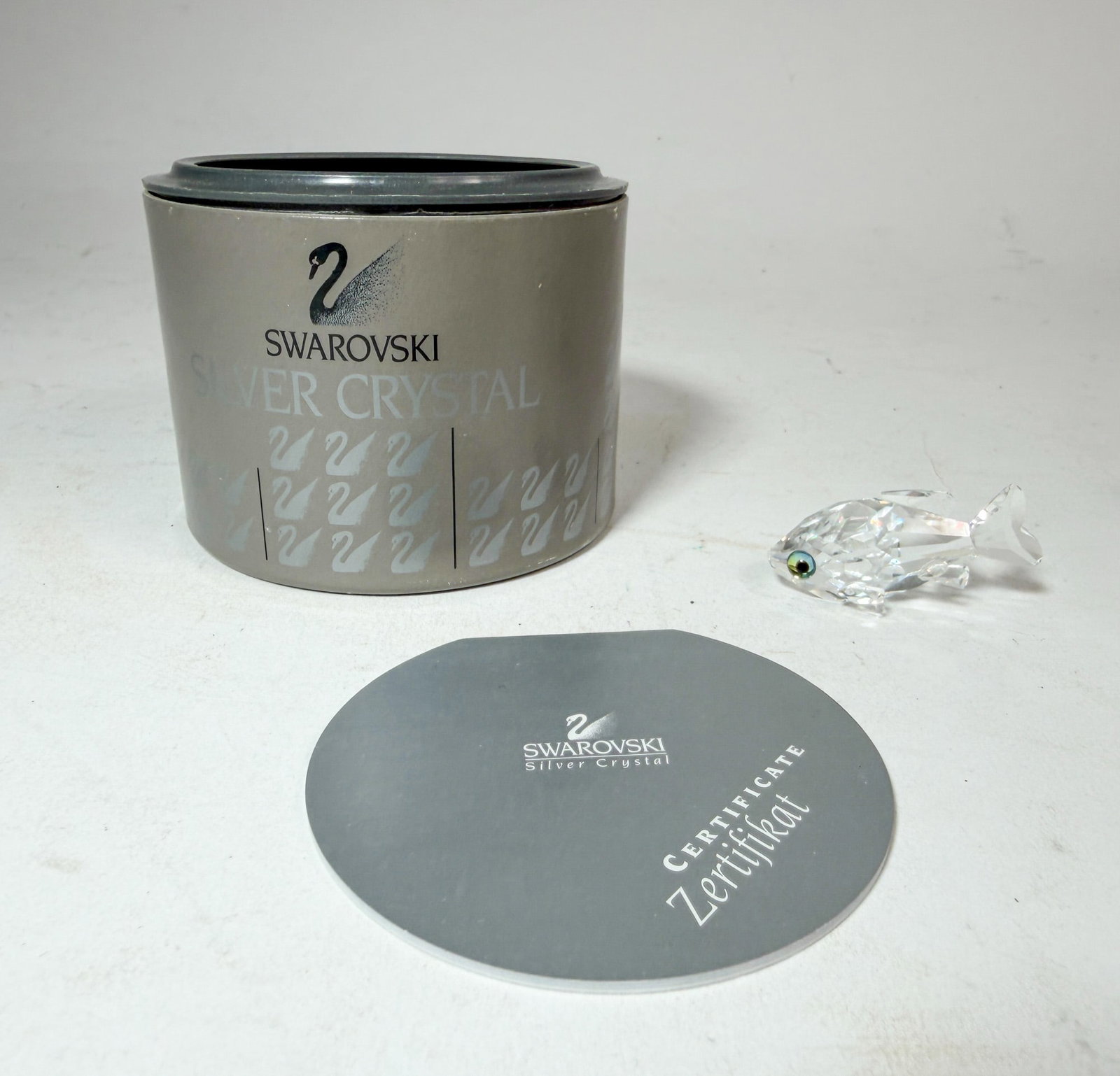 Swarovski " Mini GoldFish" Crystal Figurine IOB: Swarovski " Mini GoldFish" Crystal Figurine IOB Size 1.5"L Literature Brooks Auction – Online Auction Terms & Conditions Contact: (856) 694-2960 | info@brooks.auction READ BEFORE YOU BID: We