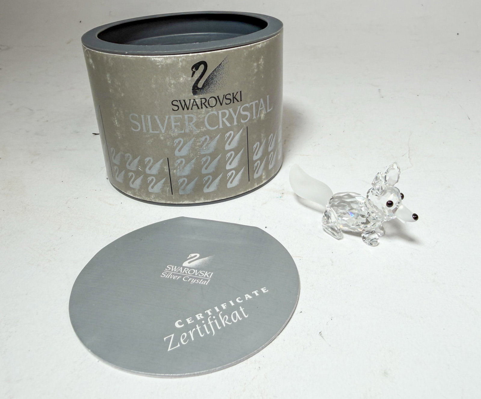 Swarovski " Miniature Running Fox " Crystal Figurine IOB: Swarovski " Miniature Running Fox " Crystal Figurine IOB Size 1.75" l Literature Brooks Auction – Online Auction Terms & Conditions Contact: (856) 694-2960 | info@brooks.auction READ BEFORE