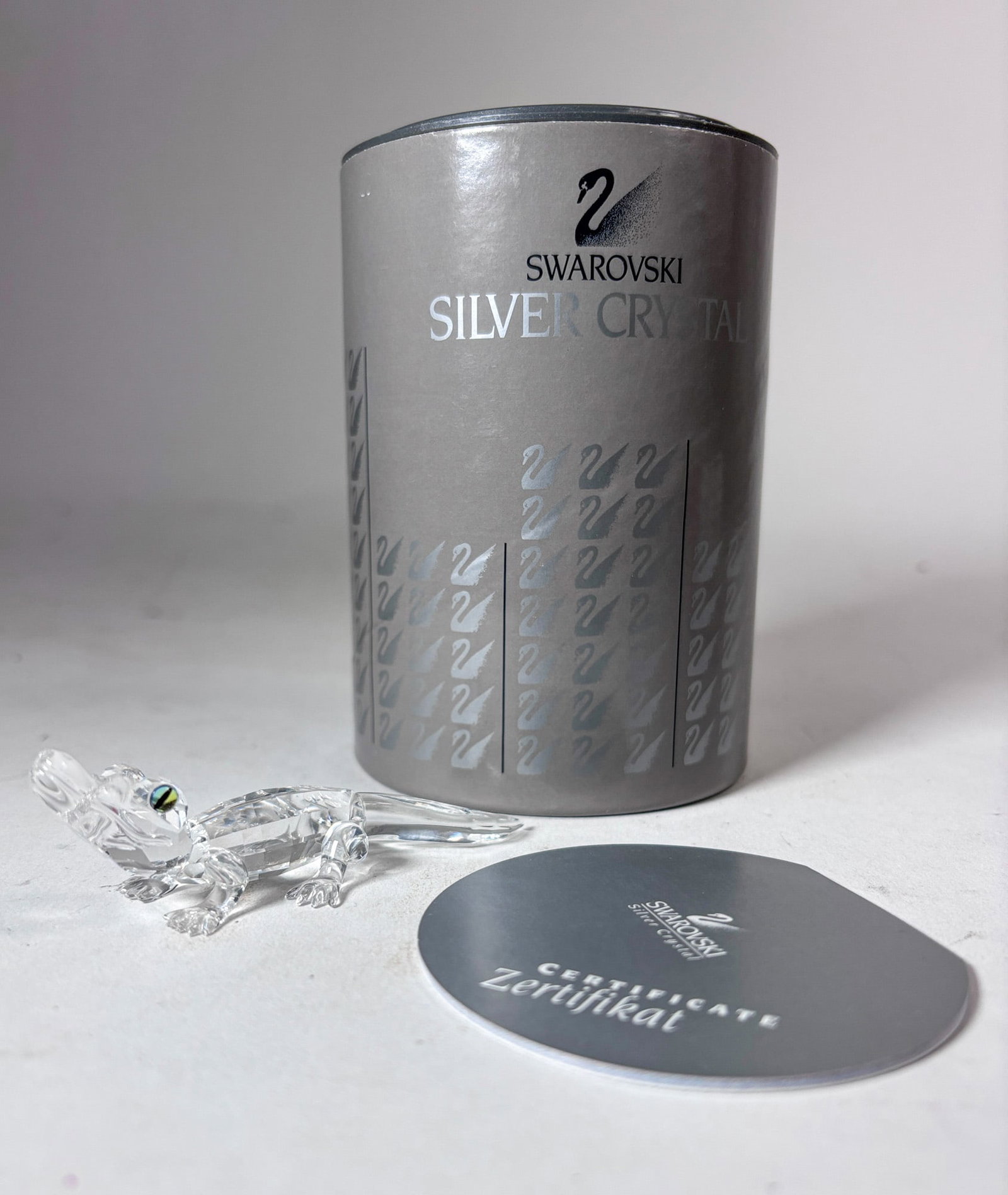 Swarovski Silver Crystal Alligator Figurine IOB: Swarovski Silver Crystal Alligator Figurine IOB Size 3.5" L Literature Brooks Auction – Online Auction Terms & Conditions Contact: (856) 694-2960 | info@brooks.auction READ BEFORE YOU BID:</