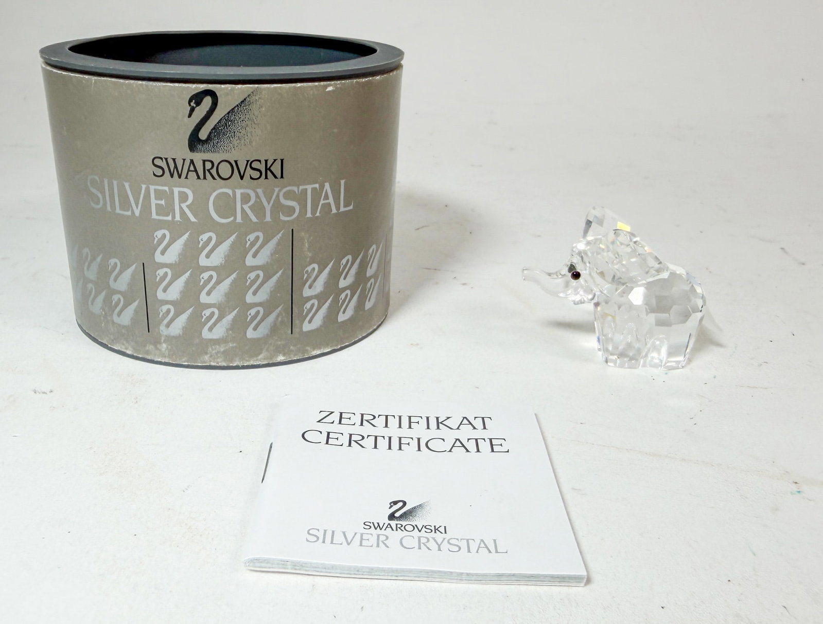 Swarovski Silver Crystal Elephant IOB: Swarovski Silver Crystal Elephant IOB Size 1.25" H Literature Brooks Auction – Online Auction Terms & Conditions Contact: (856) 694-2960 | info@brooks.auction READ BEFORE YOU BID: We want you