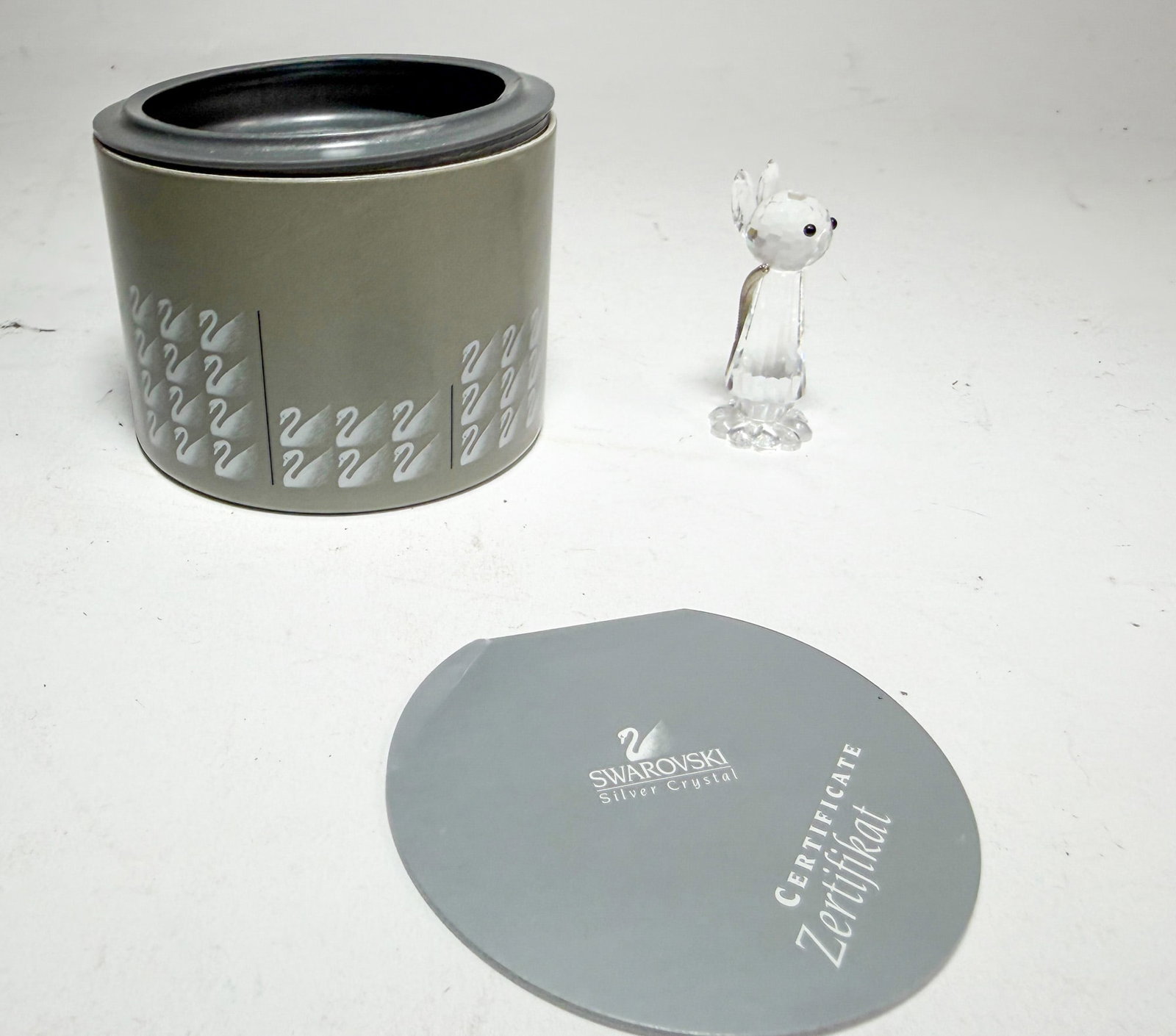 Swarovski Silver Crystal Replica Cat IOB: Swarovski Silver Crystal Replica Cat IOB, missing nose and whiskers Size 2" H Literature Brooks Auction – Online Auction Terms & Conditions Contact: (856) 694-2960 | info@brooks.auction READ