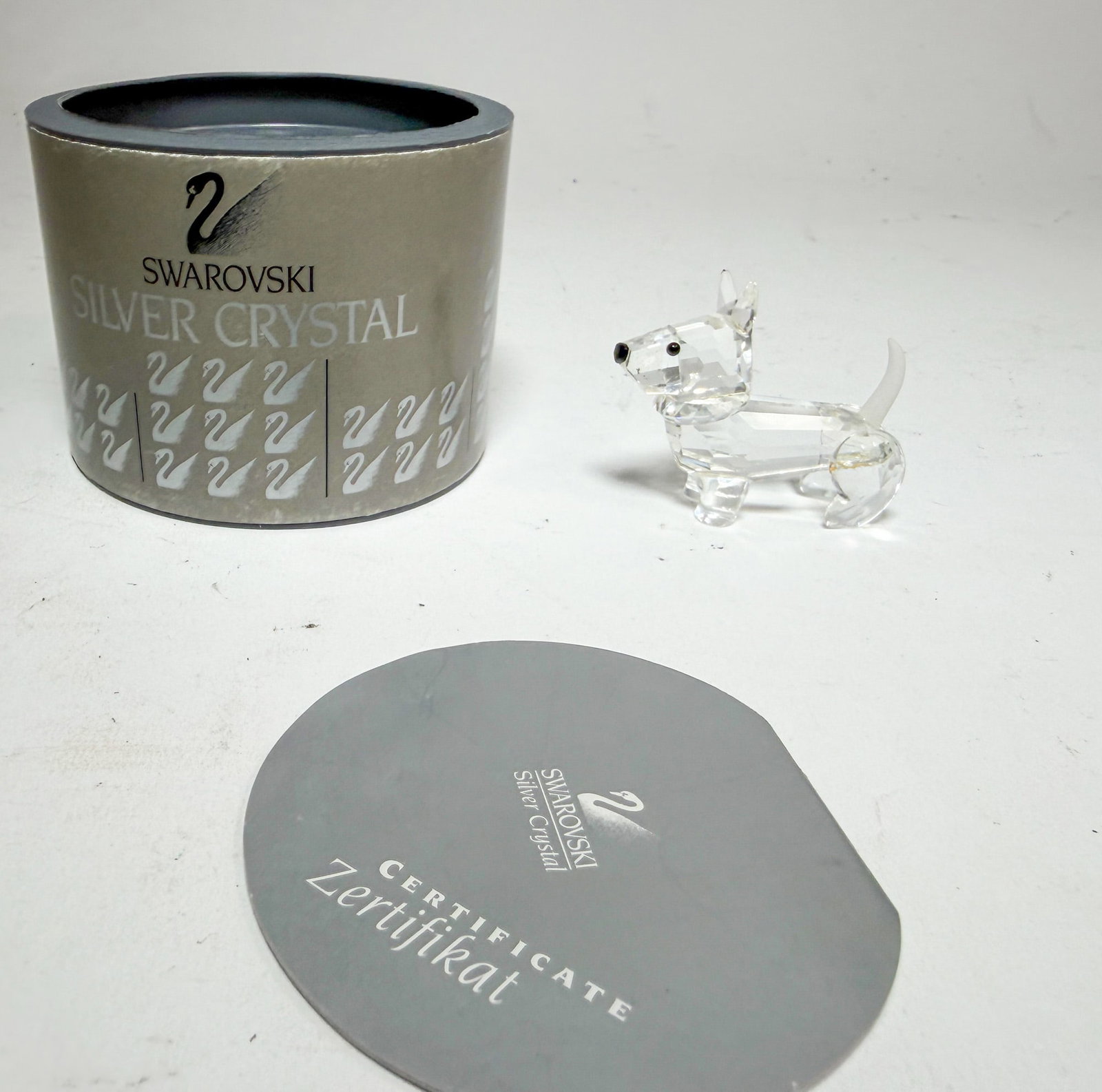 Swarovski Silver Crystal Scotch Terrier IOB: Swarovski Silver Crystal Scotch Terrier IOB Size 1.5" H Literature Brooks Auction – Online Auction Terms & Conditions Contact: (856) 694-2960 | info@brooks.auction READ BEFORE YOU BID: We want