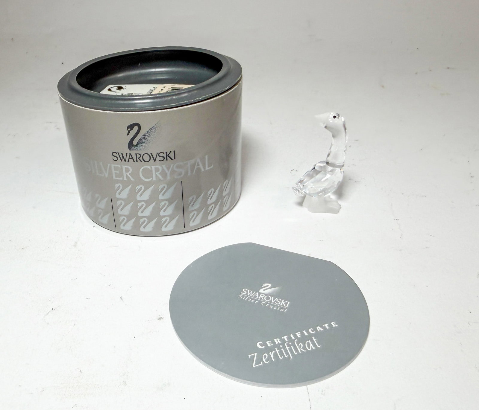 Swarovski Silver Crystal Goose IOB: Swarovski Silver Crystal Goose IOB Size 2" H Literature Brooks Auction – Online Auction Terms & Conditions Contact: (856) 694-2960 | info@brooks.auction READ BEFORE YOU BID: We want you to feel