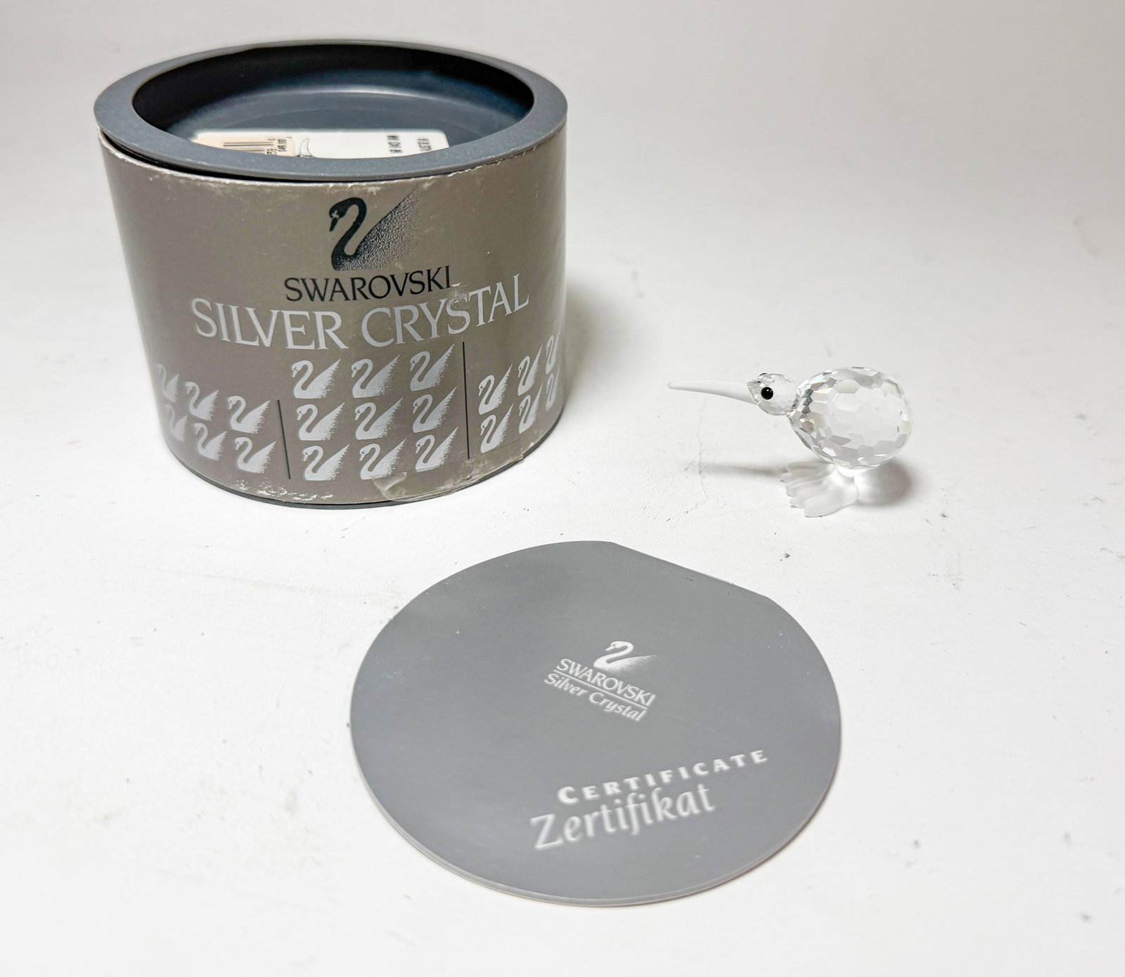 Swarovski Silver Crystal Kiwi IOB: Swarovski Silver Crystal Kiwi IOB Size 1" H Literature Brooks Auction – Online Auction Terms & Conditions Contact: (856) 694-2960 | info@brooks.auction READ BEFORE YOU BID: We want you to feel