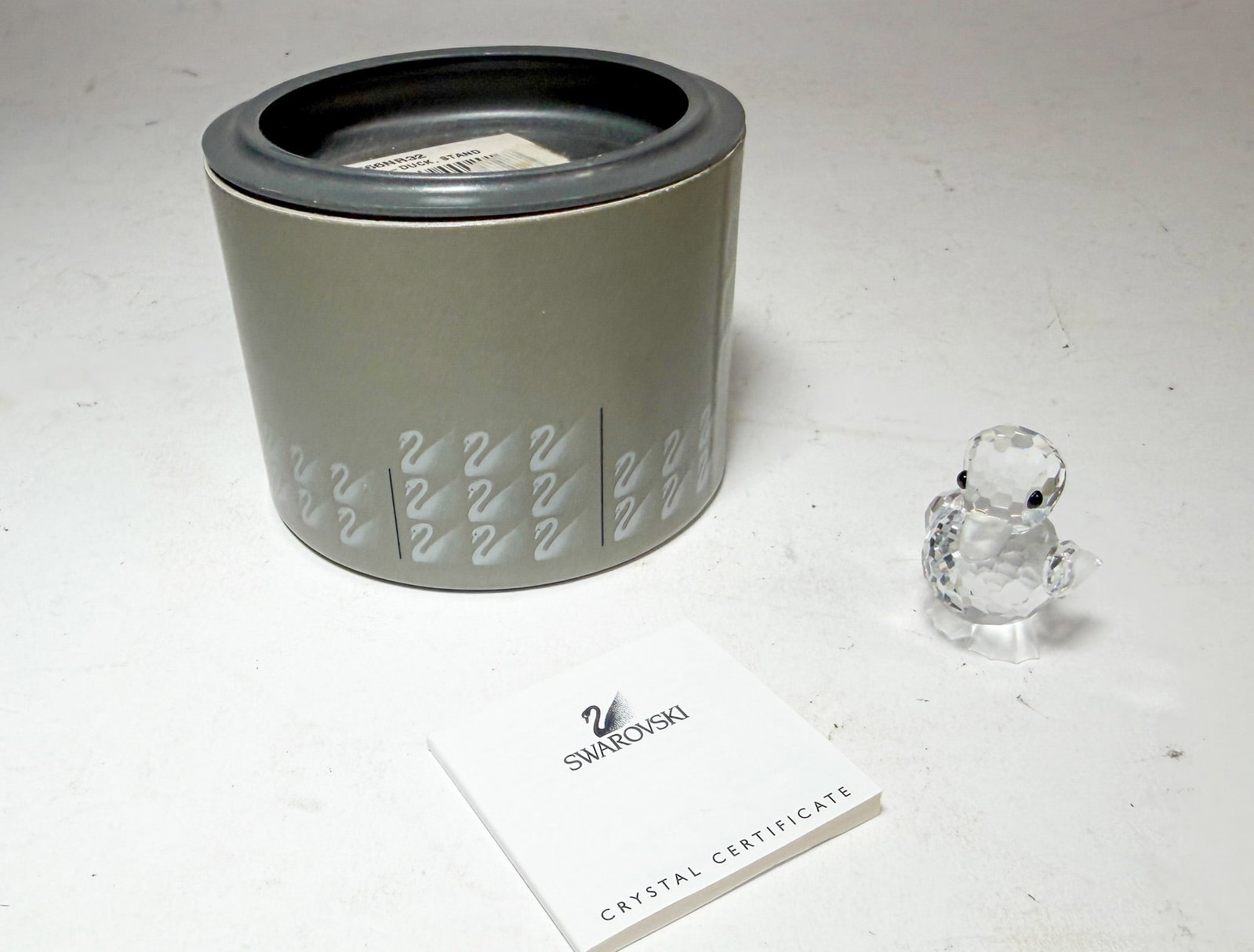 Swarovski Silver Crystal Standing Duck IOB: Swarovski Silver Crystal Standing Duck IOB Size 1.25" H Literature Brooks Auction – Online Auction Terms & Conditions Contact: (856) 694-2960 | info@brooks.auction READ BEFORE YOU BID: W