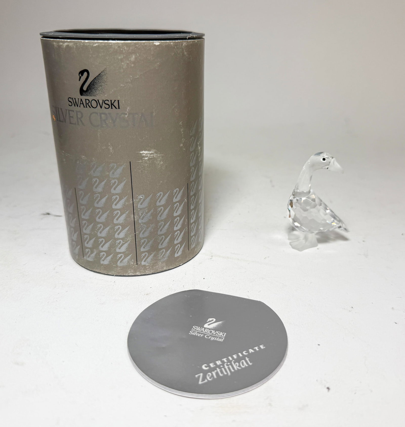 Swarovski Silver Crystal Mother Goose IOB: Swarovski Silver Crystal Mother Goose IOB Size 2.5" H Literature Brooks Auction – Online Auction Terms & Conditions Contact: (856) 694-2960 | info@brooks.auction READ BEFORE YOU BID: We want