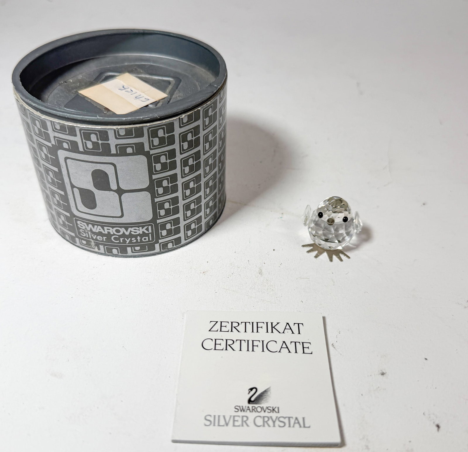 Swarovski Silver Crystal Chick IOB: Swarovski Silver Crystal Chick IOB Size 1" H Literature Brooks Auction – Online Auction Terms & Conditions Contact: (856) 694-2960 | info@brooks.auction READ BEFORE YOU BID: We want you to feel