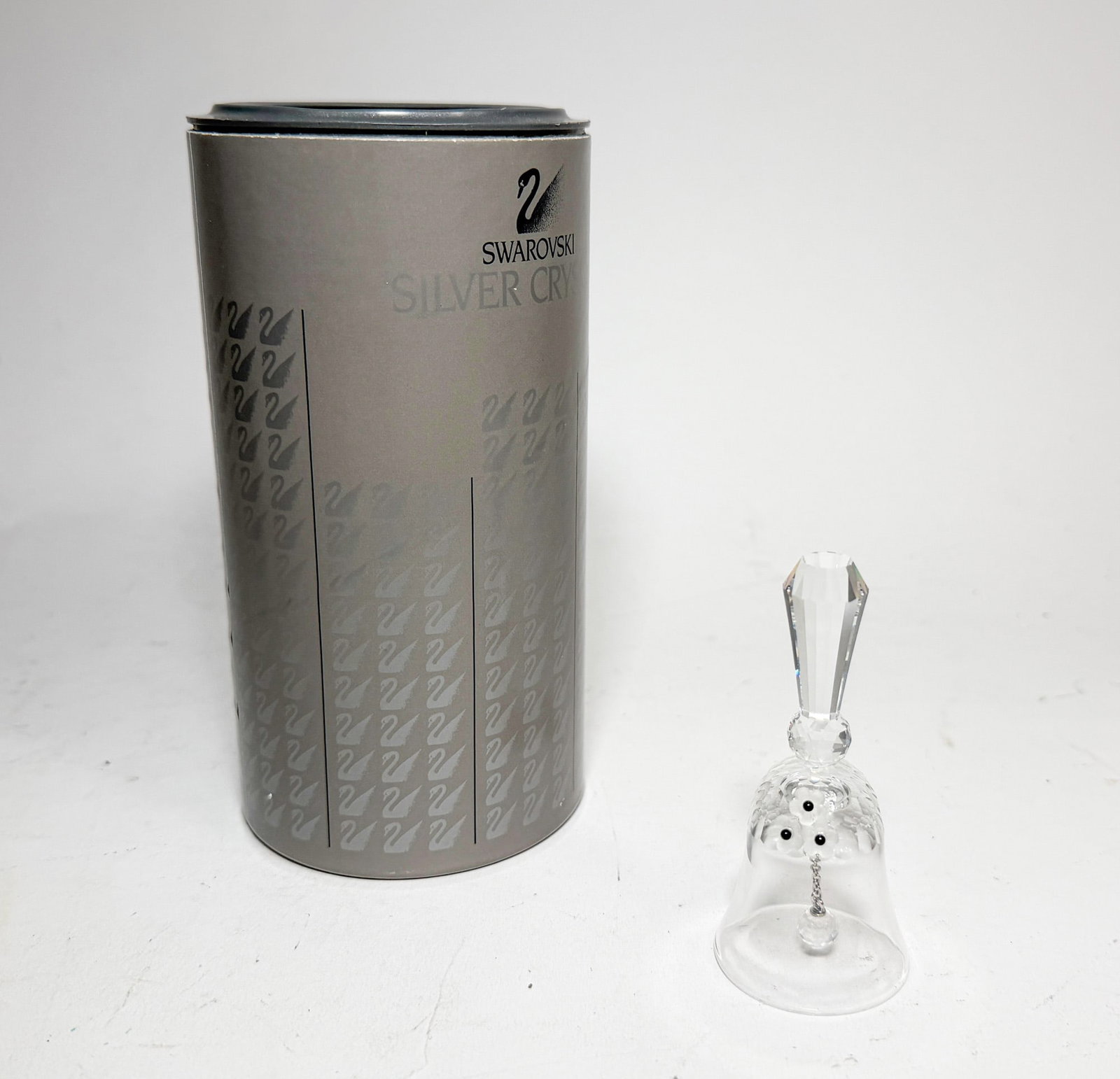 Swarovski Silver Crystal Dinner Bell IOB: Swarovski Silver Crystal Dinner Bell IOB Size 3.25" H Literature Brooks Auction – Online Auction Terms & Conditions Contact: (856) 694-2960 | info@brooks.auction READ BEFORE YOU BID: We