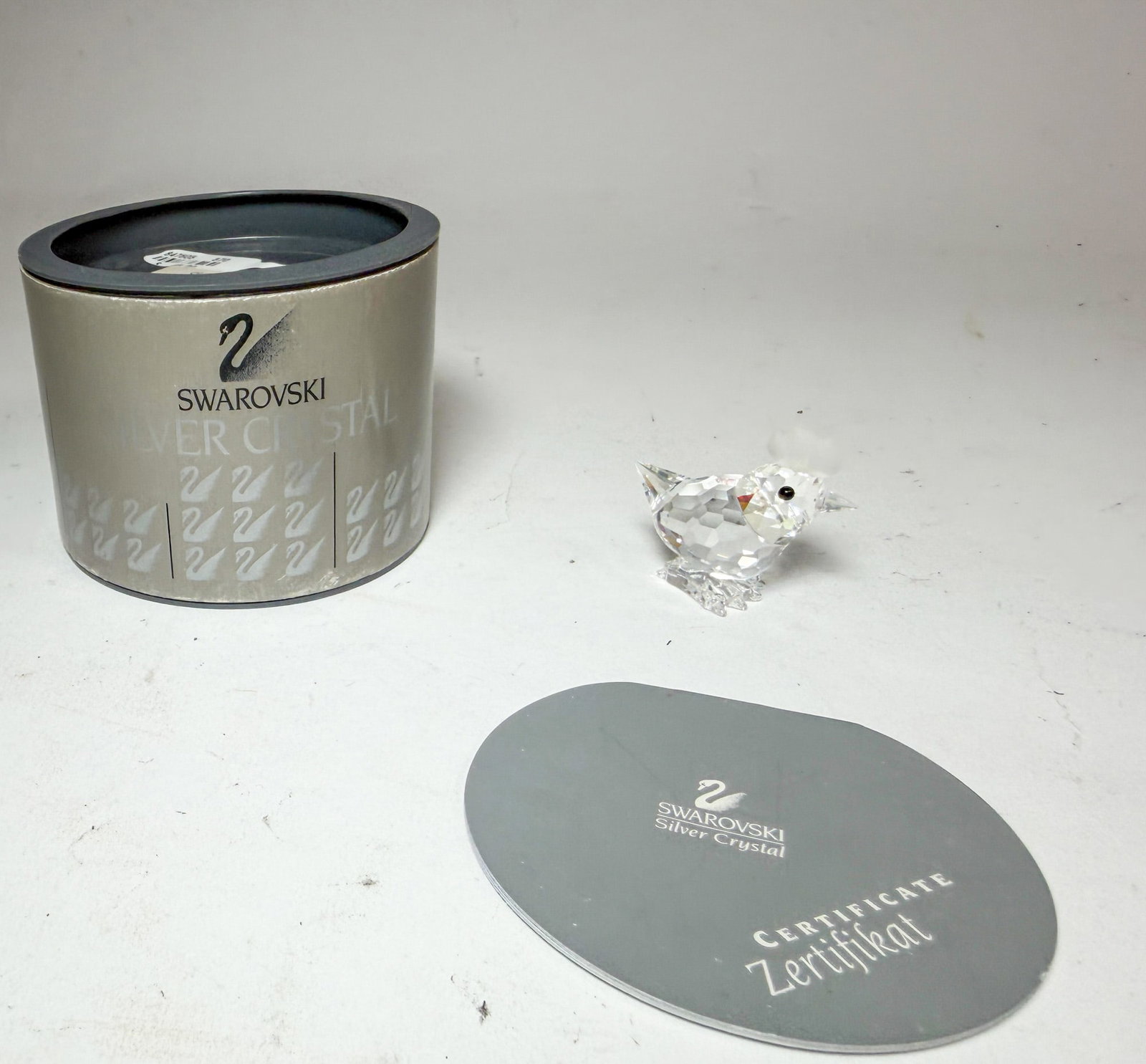 Swarovski Silver Crystal Hen IOB: Swarovski Silver Crystal Hen IOB Size 1.5" H Literature Brooks Auction – Online Auction Terms & Conditions Contact: (856) 694-2960 | info@brooks.auction READ BEFORE YOU BID: We want you to feel