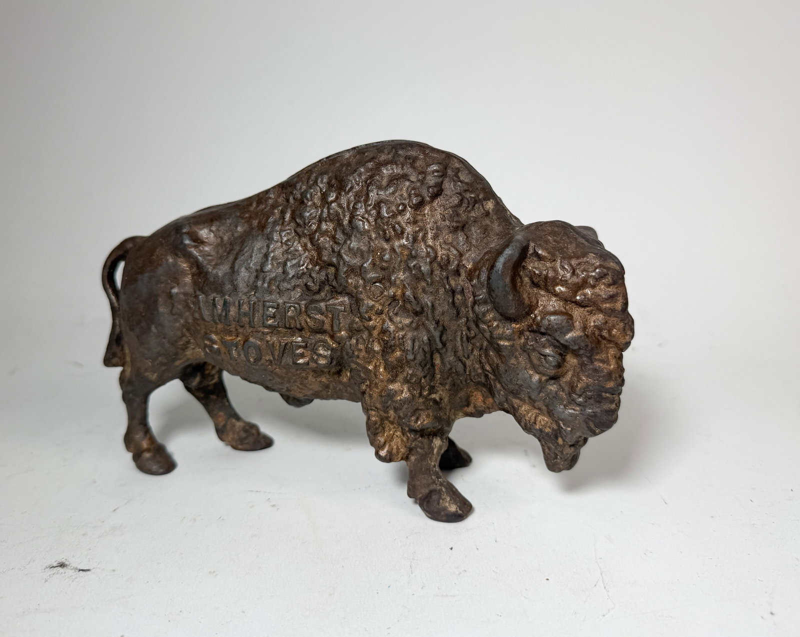 "Amherst Stoves" Cast Iron Buffalo Advertising Still Bank: "Amherst Stoves" Cast Iron Buffalo Advertising Still Bank Size 6" H Literature Brooks Auction – Online Auction Terms & Conditions Contact: (856) 694-2960 | info@brooks.auction READ BEFORE YOU