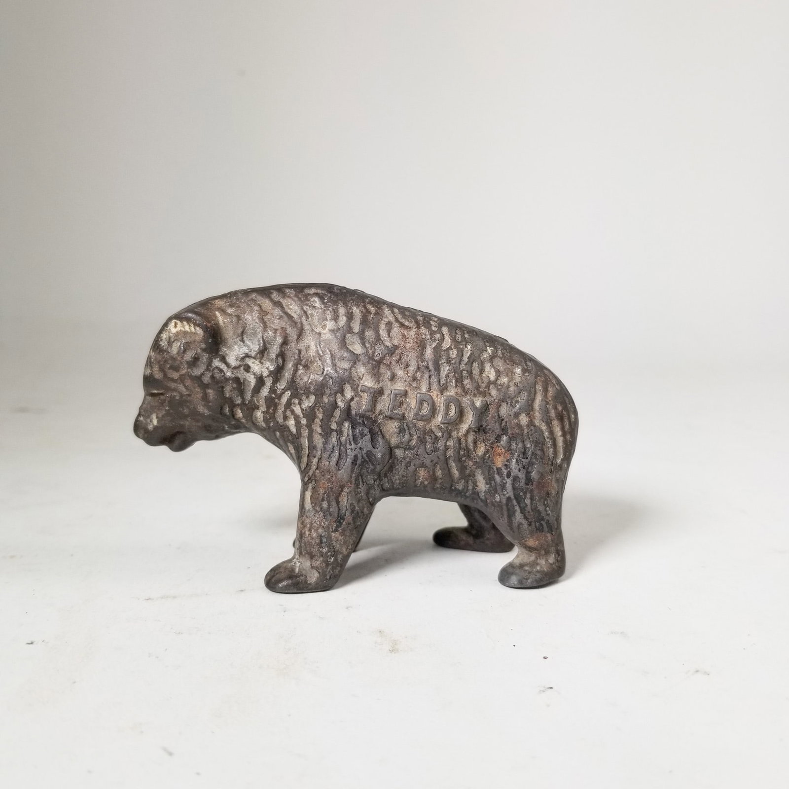 "Teddy" Cast Iron Bear Bank: "Teddy" Cast Iron Bear Bank Size 3" H Literature Brooks Auction – Online Auction Terms & Conditions Contact: (856) 694-2960 | info@brooks.auction READ BEFORE YOU BID: We want you to feel