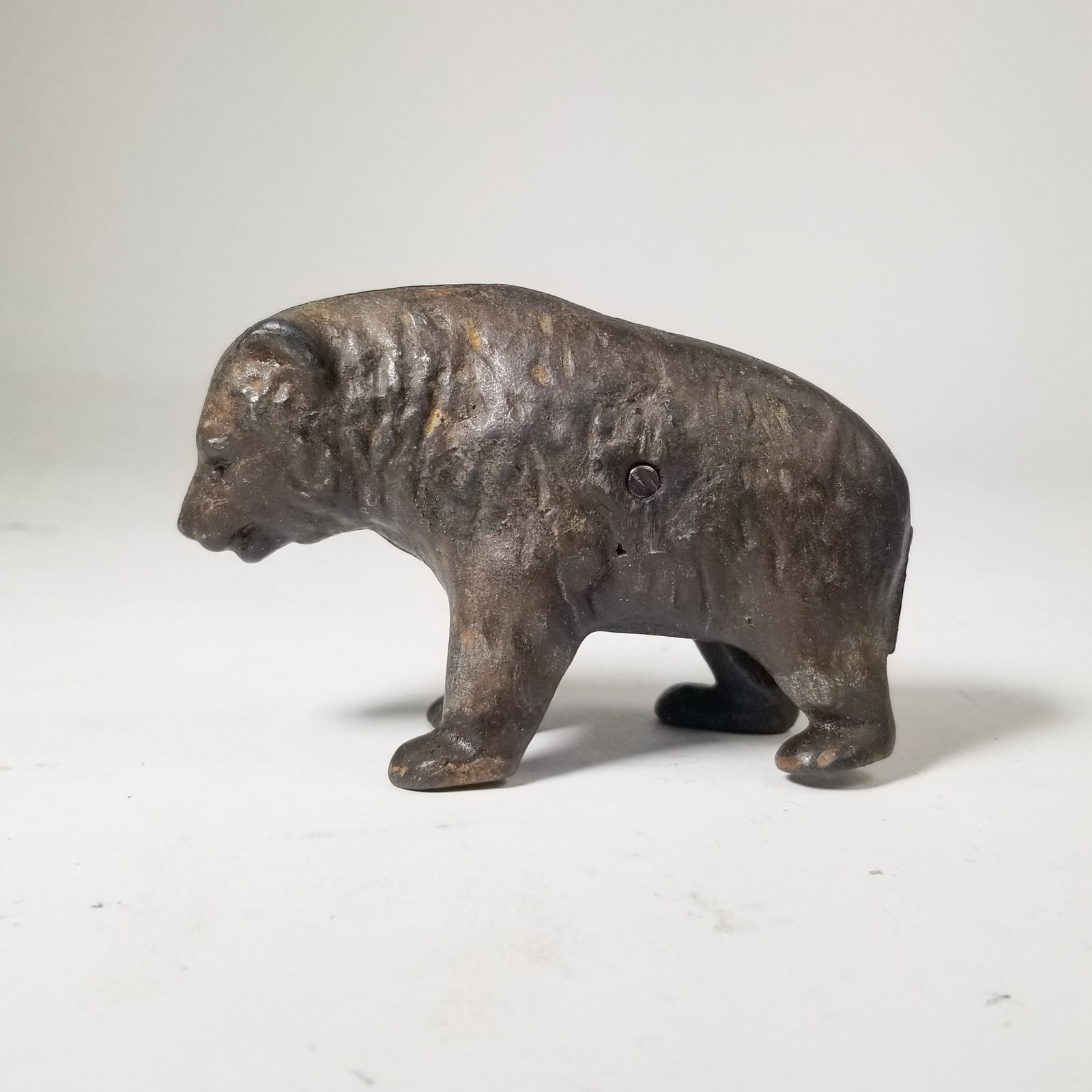 Cast Iron Bear Still Bank: Cast Iron Bear Still Bank Size 3" H Literature Brooks Auction – Online Auction Terms & Conditions Contact: (856) 694-2960 | info@brooks.auction READ BEFORE YOU BID: We want you to feel c
