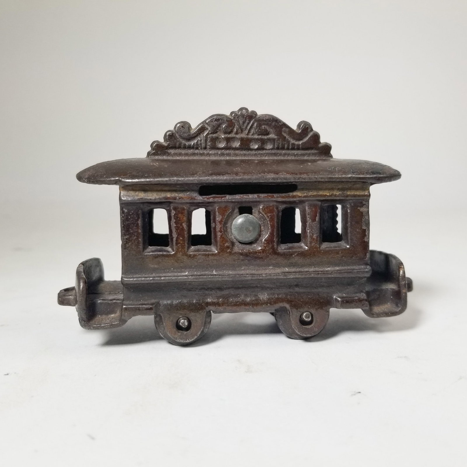 Cast Iron Trolley Bank: Cast Iron Trolley Bank Size 3" H Literature Brooks Auction – Online Auction Terms & Conditions Contact: (856) 694-2960 | info@brooks.auction READ BEFORE YOU BID: We want you to feel conf