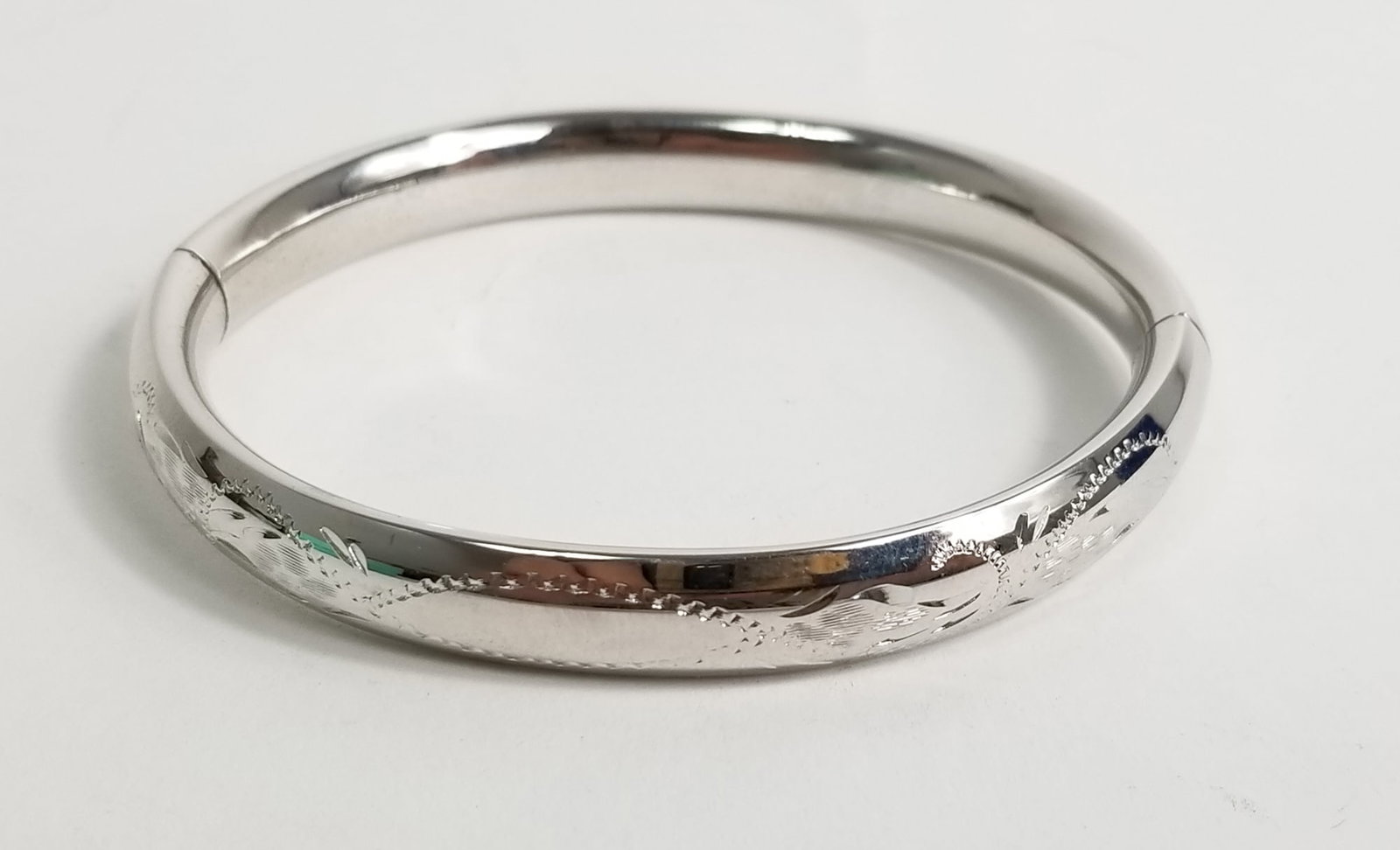 Tiffany & Co. Sterling Silver Bangle: Tiffany & Co. Sterling Silver Bangle, marked Sterling, weight 12.4g Literature Brooks Auction – Online Auction Terms & Conditions