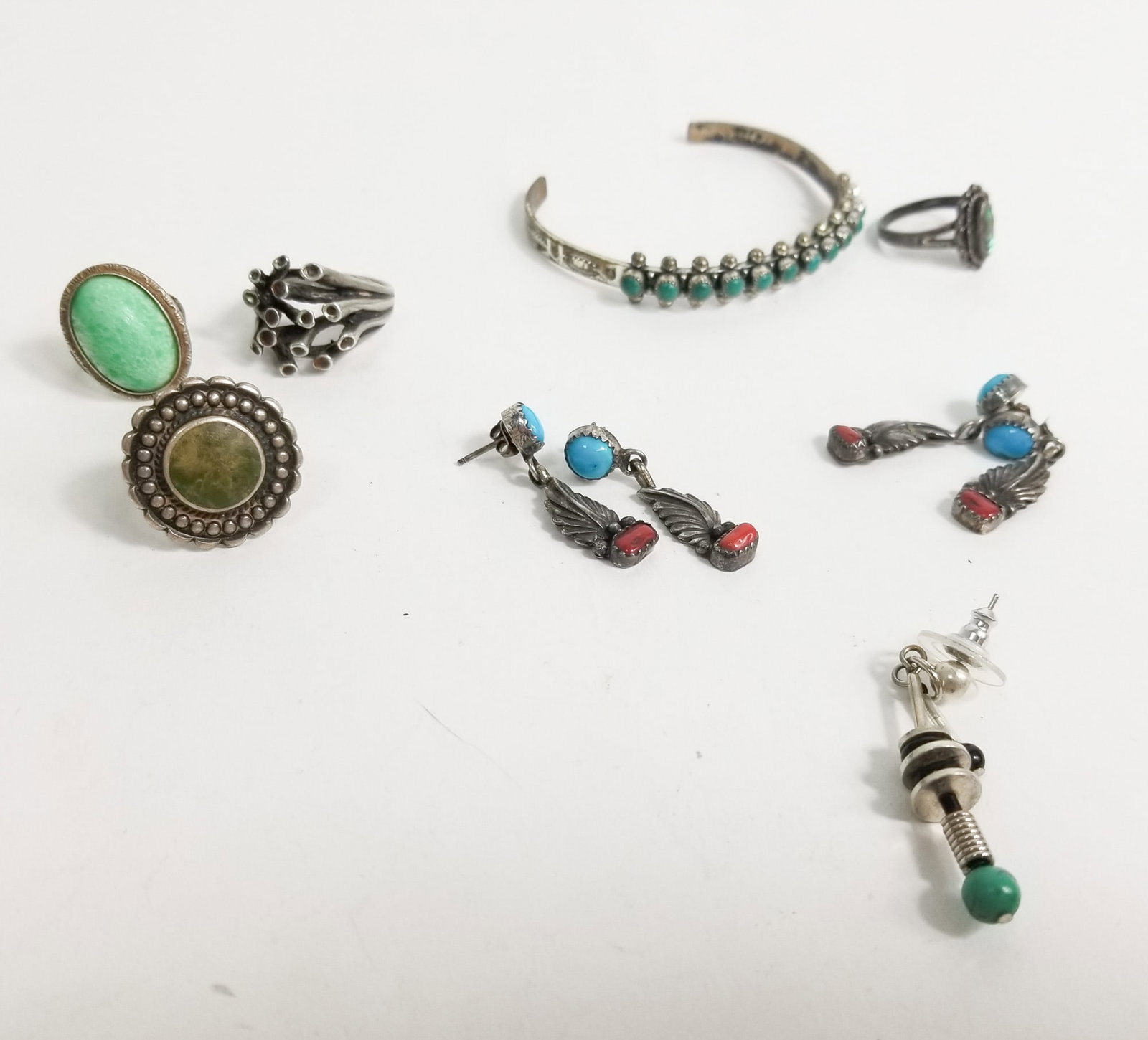 Earthy Sterling Silver Jewelry assignment: Earthy Sterling Silver Jewelry assignment: earring pairs, bracelets, and rings (1) size 5, (3) size 7, total weight 52g Literature Brooks Auction – Online Auction Terms & Conditions