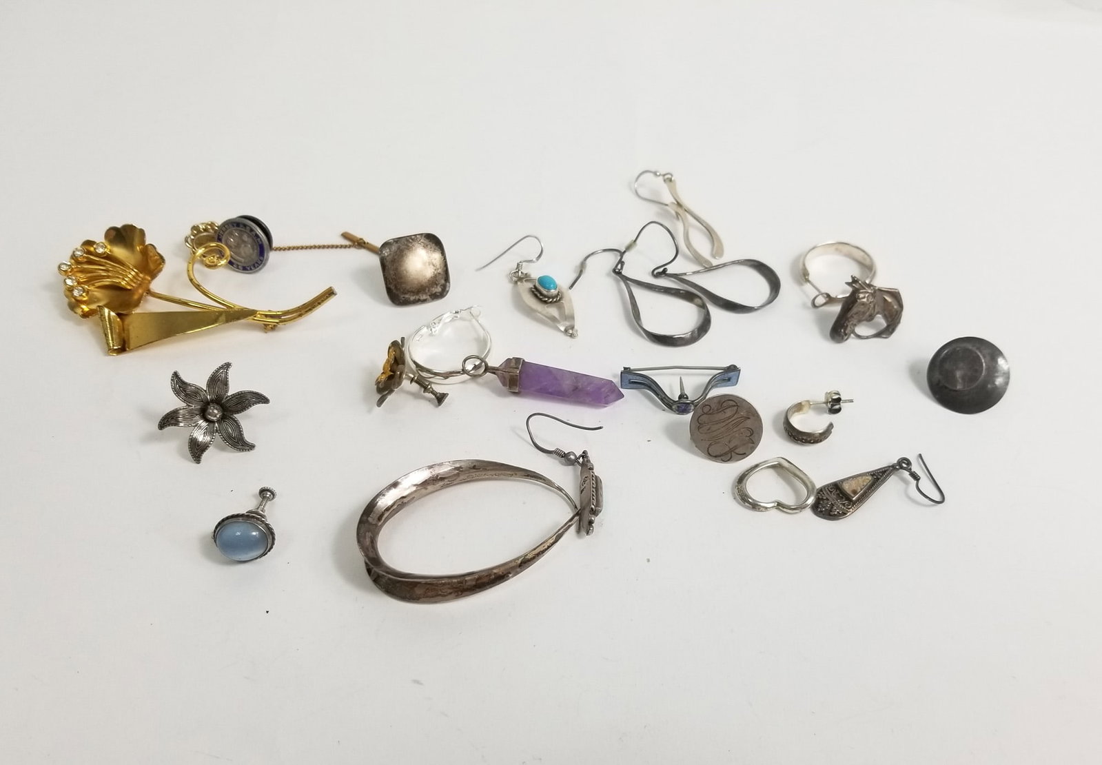 Assortment of Non-Matching Sterling Earrings: Assortment of Non-Matching Sterling Earrings, marked 925, weight 67.6 g Literature Brooks Auction – Online Auction Terms & Conditions