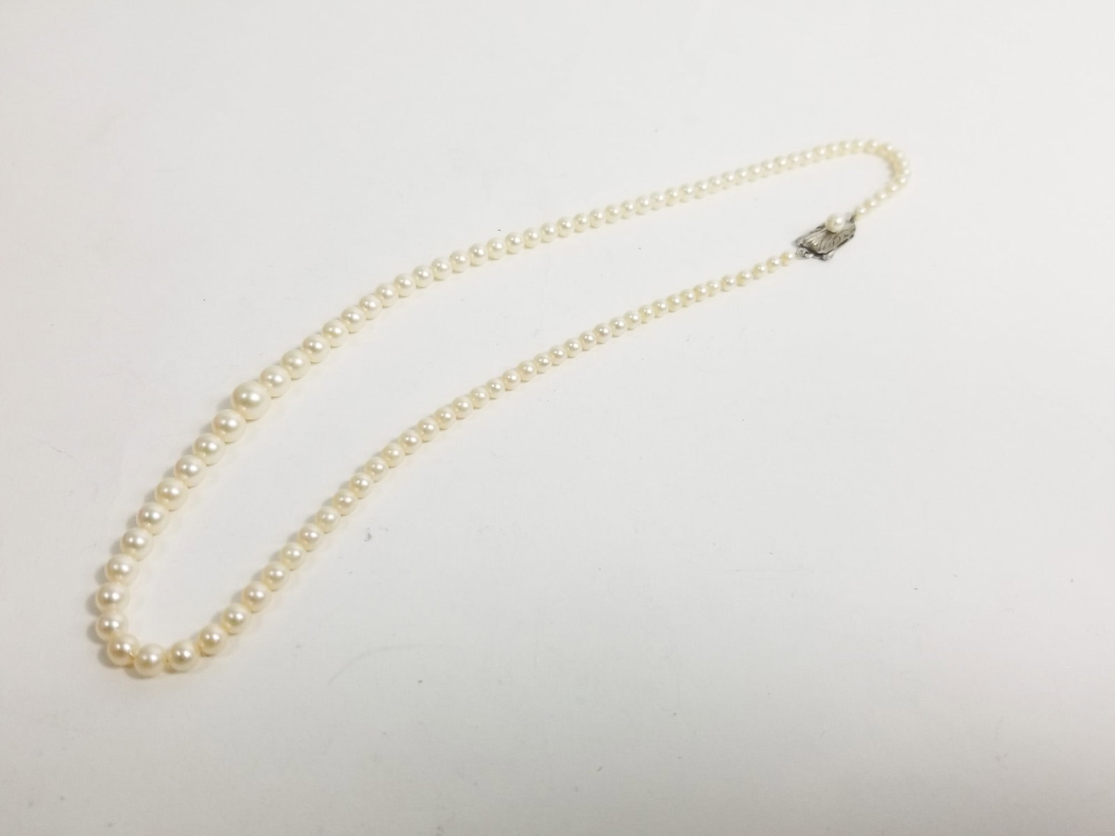 Vintage Pearl Necklace with Silver Clasp: Vintage Pearl Necklace with Silver Clasp Literature Brooks Auction – Online Auction Terms & Conditions