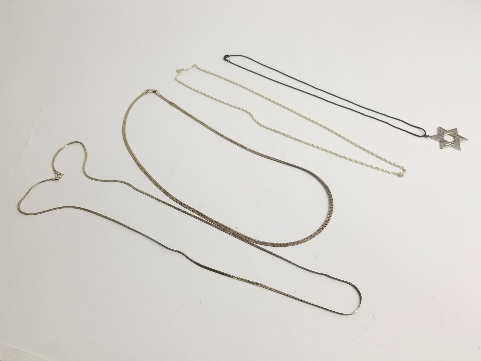 Assortment of Sterling Silver Necklaces: Assortment of Sterling Silver Necklaces, marked 925, Total Weight 32.4g Literature Brooks Auction – Online Auction Terms & Conditions
