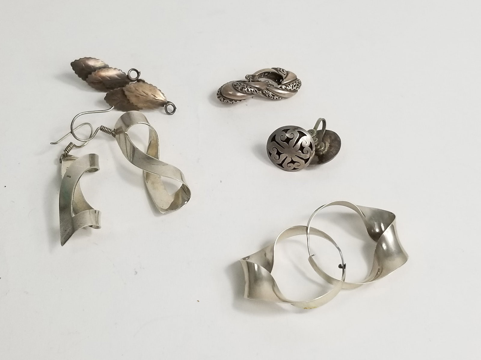 Five Sets of Sterling Silver Earrings: (5) Sets of Sterling Silver Earrings, marked 925,weight 36.1g Literature Brooks Auction – Online Auction Terms & Conditions