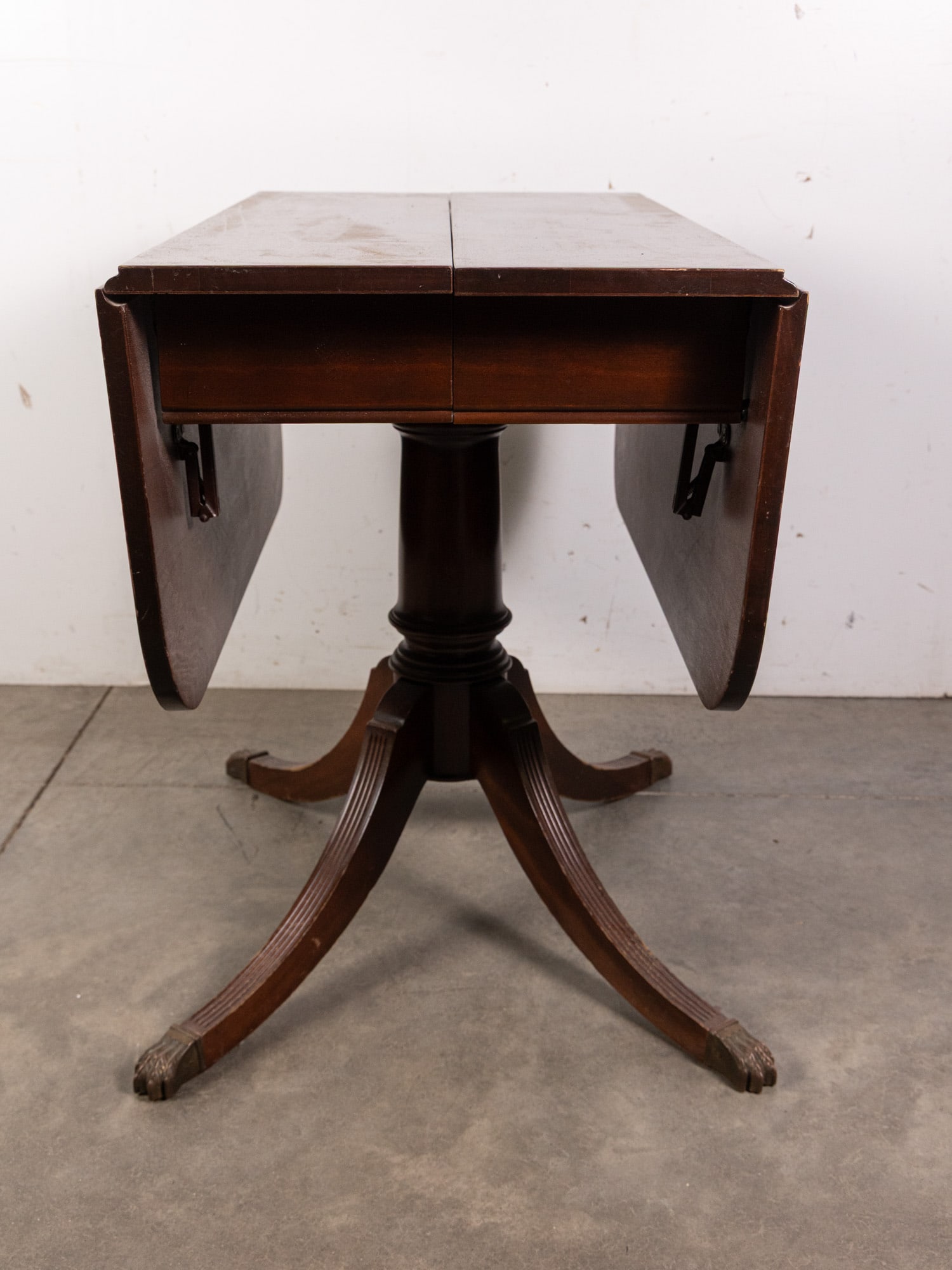 Antique Drop Side Table w/ Brass Claw Feet: Antique Drop Side Table w/ Brass Claw Feet Size 30" x 48" x 36" Literature Brooks Auction – Online Auction Terms & Conditions Contact: (856) 694-2960 | info@brooks.auction READ BEFORE YOU BID: