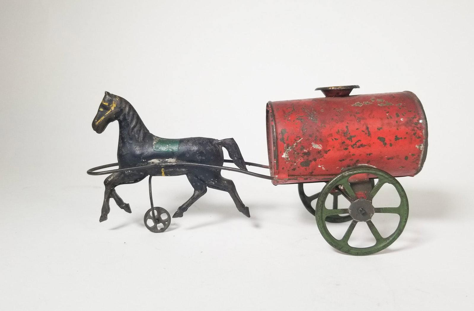Early Tin Toy Horse Drawn Cart: Early Tin Toy Horse Drawn Cart Size 3" x 7" x 3" Literature Brooks Auction – Online Auction Terms & Conditions Contact: (856) 694-2960 | info@brooks.auction READ BEFORE YOU BID: We want