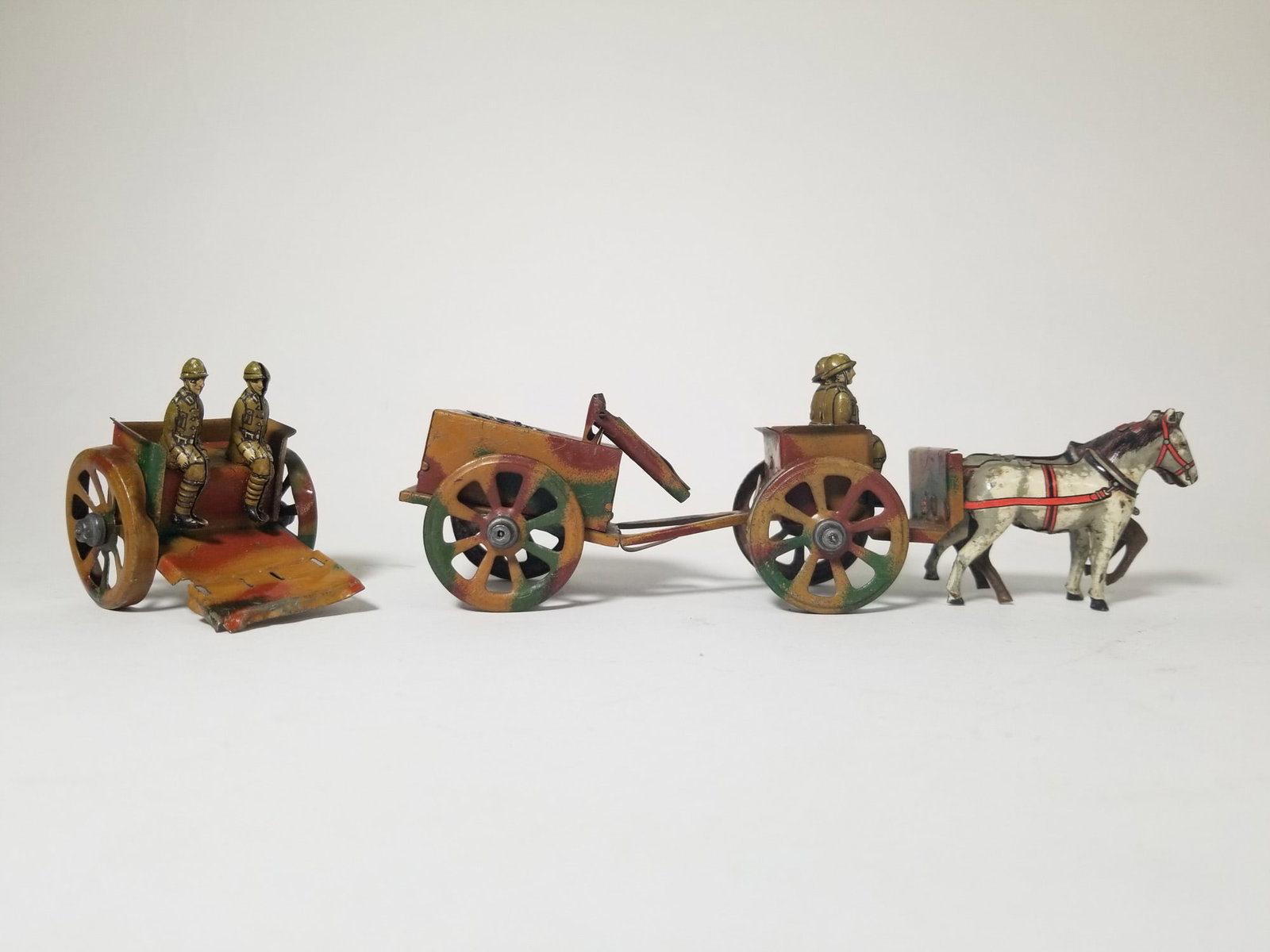 Grouping of Three Antique Tin Litho Military Toys: Grouping of Three Antique Tin Litho Military Toys Size 7" x 12" x 12" Literature Brooks Auction – Online Auction Terms & Conditions Contact: (856) 694-2960 | info@brooks.auction READ BEFORE YOU