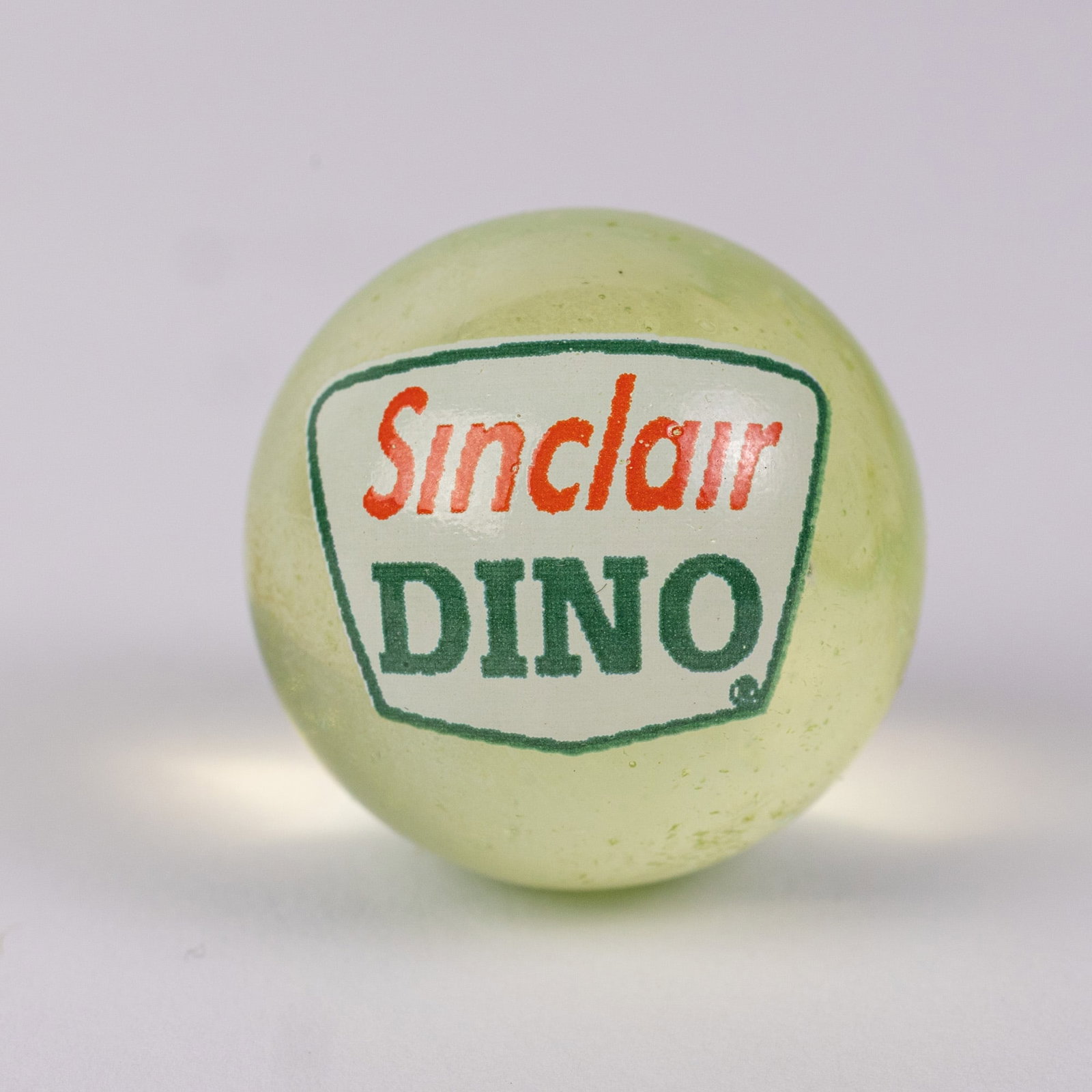 Sinclair Uranium Glass Advertising Marble: Sinclair Uranium Glass Advertising Marble Size 1" diameter Literature Brooks Auction – Online Auction Terms & Conditions Contact: (856) 694-2960 | info@brooks.auction READ BEFORE YOU BID: We