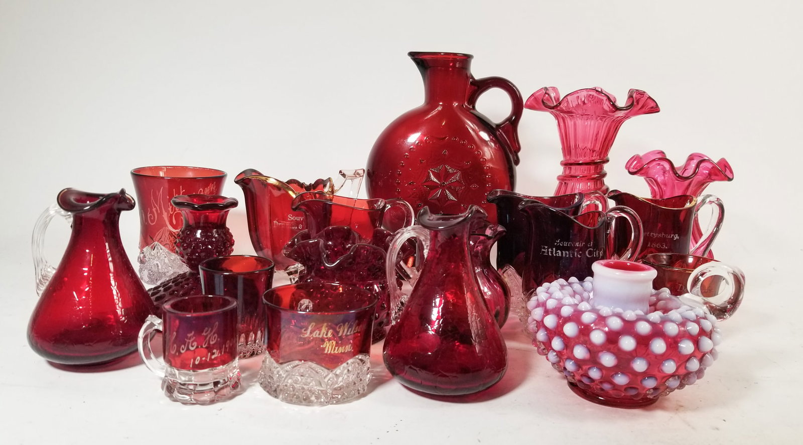 Lot of Vintage and Antique Ruby Glass Decorative Items: Lot of Vintage and Antique Ruby Glass Decorative Items Size 7" x 12" x 12" Literature Brooks Auction – Online Auction Terms & Conditions Contact: (856) 694-2960 | info@brooks.auction READ