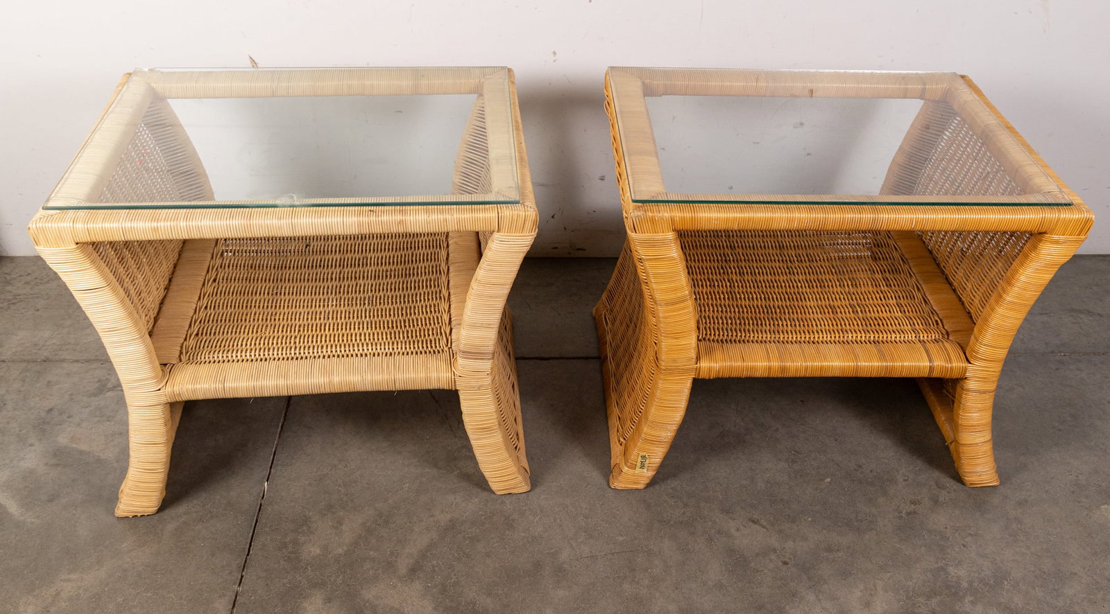 Pair of Vintage Coastal Chic Glass-Top Rattan End Tables: Pair of Vintage Coastal Chic Glass-Top Rattan End Tables Size 22" x 27" x 21" Literature Brooks Auction – Online Auction Terms & Conditions Contact: (856) 694-2960 | info@brooks.auction READ