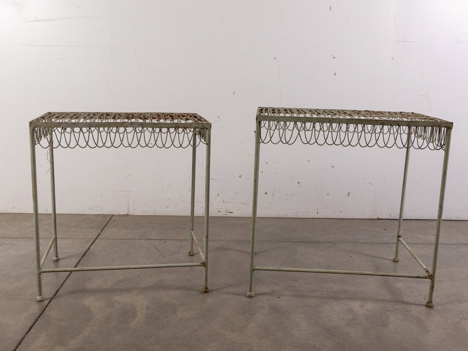 Pair of Mid Century Wrought Iron Nesting Tables: Pair of Mid Century Wrought Iron Nesting Tables Size 22" x 16" x 22" Literature Brooks Auction – Online Auction Terms & Conditions Contact: (856) 694-2960 | info@brooks.auction READ BEFORE Y