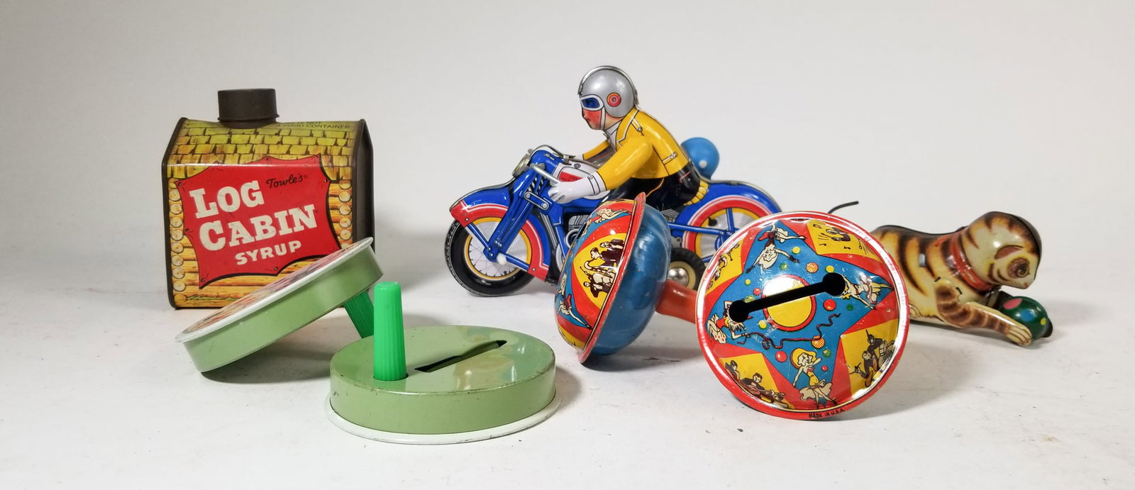 Vintage Tin Toy Assortment ft. Wind-Up Motorcycle & Sidecar: Vintage Tin Toy Assortment ft. Wind-Up Motorcycle & Sidecar Size 7" x 12" x 12" Literature Brooks Auction – Online Auction Terms & Conditions Contact: (856) 694-2960 | info@brooks.auction READ