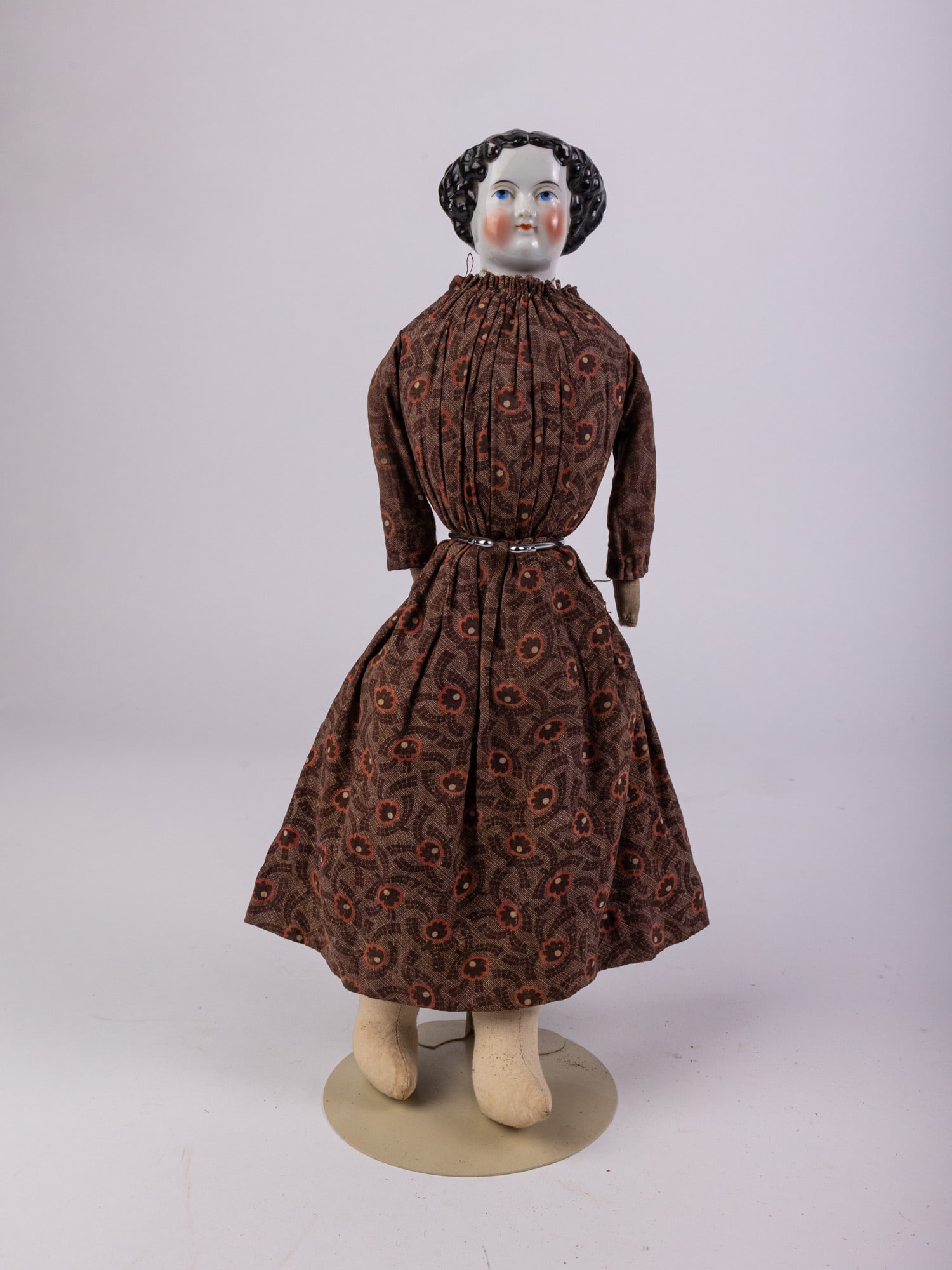 Mid 19th Century Antique China Head Doll: Likely 1850's-1860's, seems to be a repaired crack in neck. Porcelain head, cloth body, hands, and feet. Size 14.5" Literature Brooks Auction – Online Auction Terms & Conditions Contact: (856)