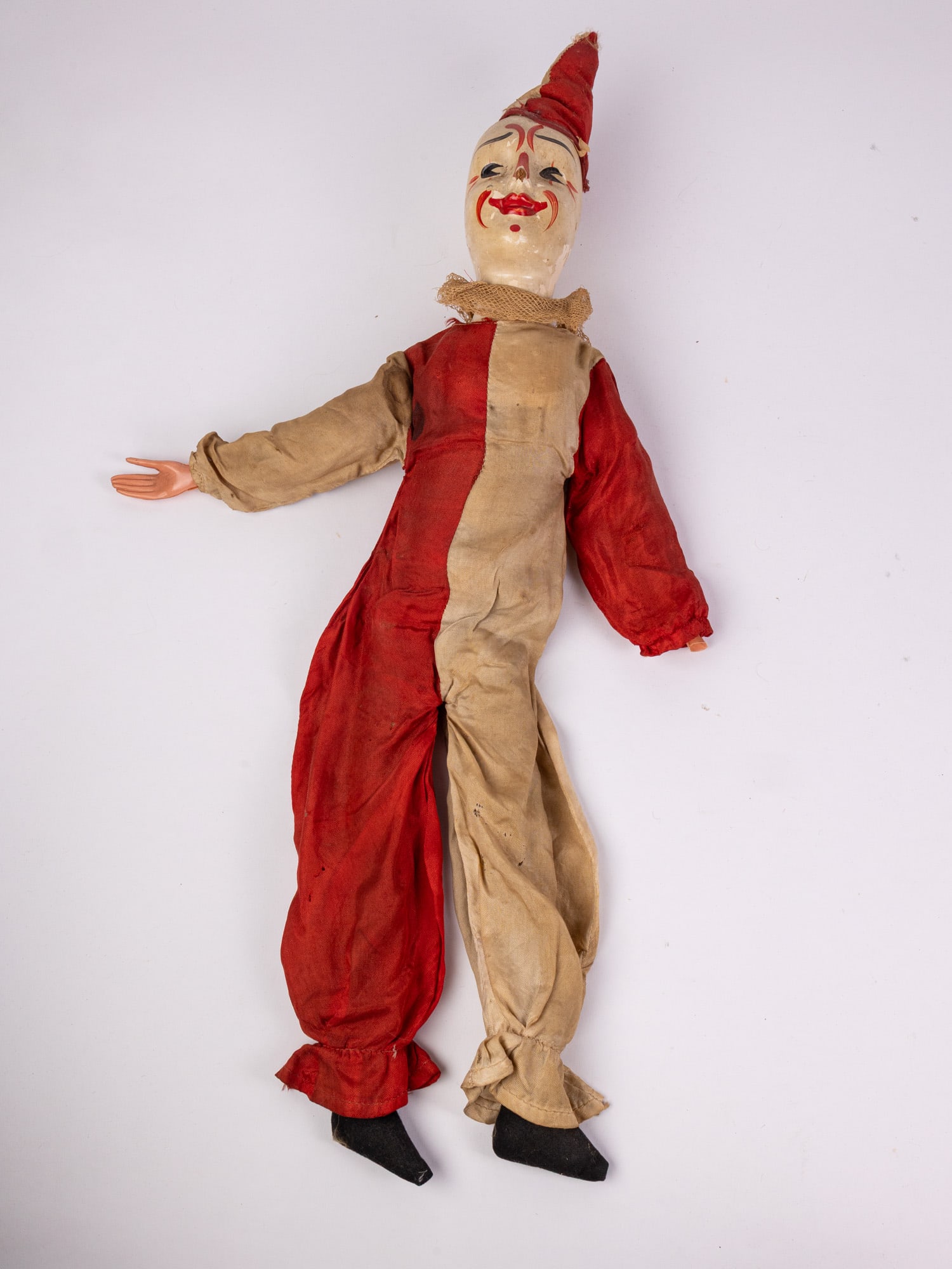 Early 20th Century Composition Clown Doll: Possibly Schoenhut?, composition head, celluloid hands. Size 26" Literature Brooks Auction – Online Auction Terms & Conditions Contact: (856) 694-2960 | info@brooks.auction READ BEFORE YOU BID: