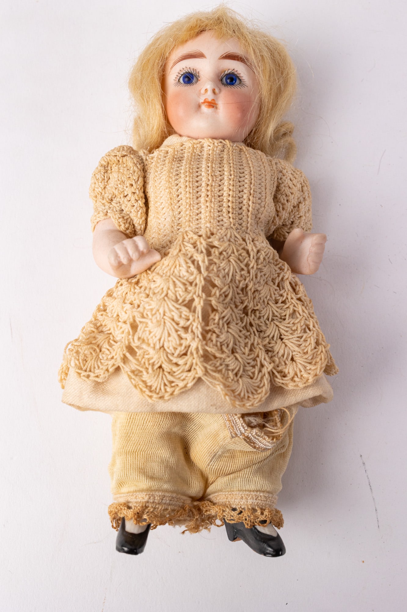 Antique 6.5" Porcelain Bisque Doll: complete bisque body, blue glass eyes & feathered brows Size 6.5" H Literature Brooks Auction – Online Auction Terms & Conditions Contact: (856) 694-2960 | info@brooks.auction READ BEFORE YOU