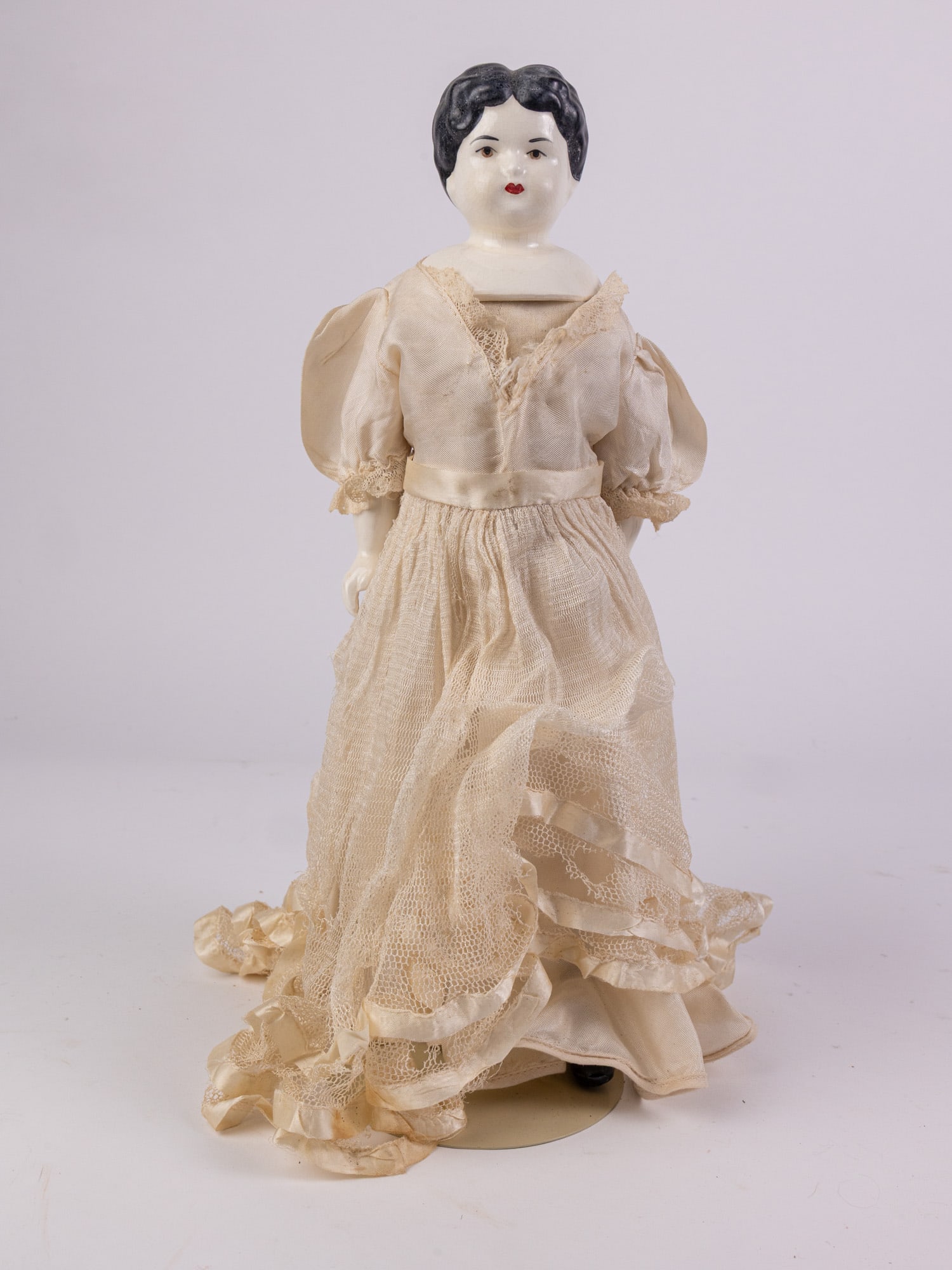 China Head Porcelain Doll: Porcelain head, hands, and feet, cloth body. Unmarked. Size 15" Literature Brooks Auction – Online Auction Terms & Conditions Contact: (856) 694-2960 | info@brooks.auction READ BEFORE YOU BI
