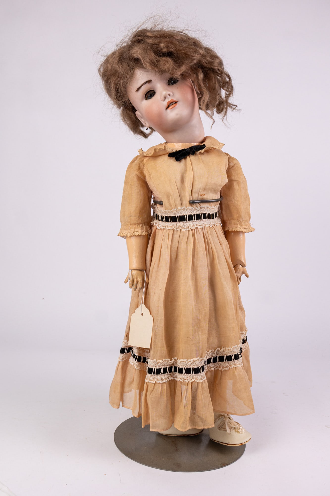 Heinrich Handwerck Simon & Halbig Bisque Doll: Bisque head, composite hands, feet, and body. Marked Heinrich Handwerck Simon & Halbig on back of neck. Literature Brooks Auction – Online Auction Terms & Conditions Contact: (856) 694-2960 | in