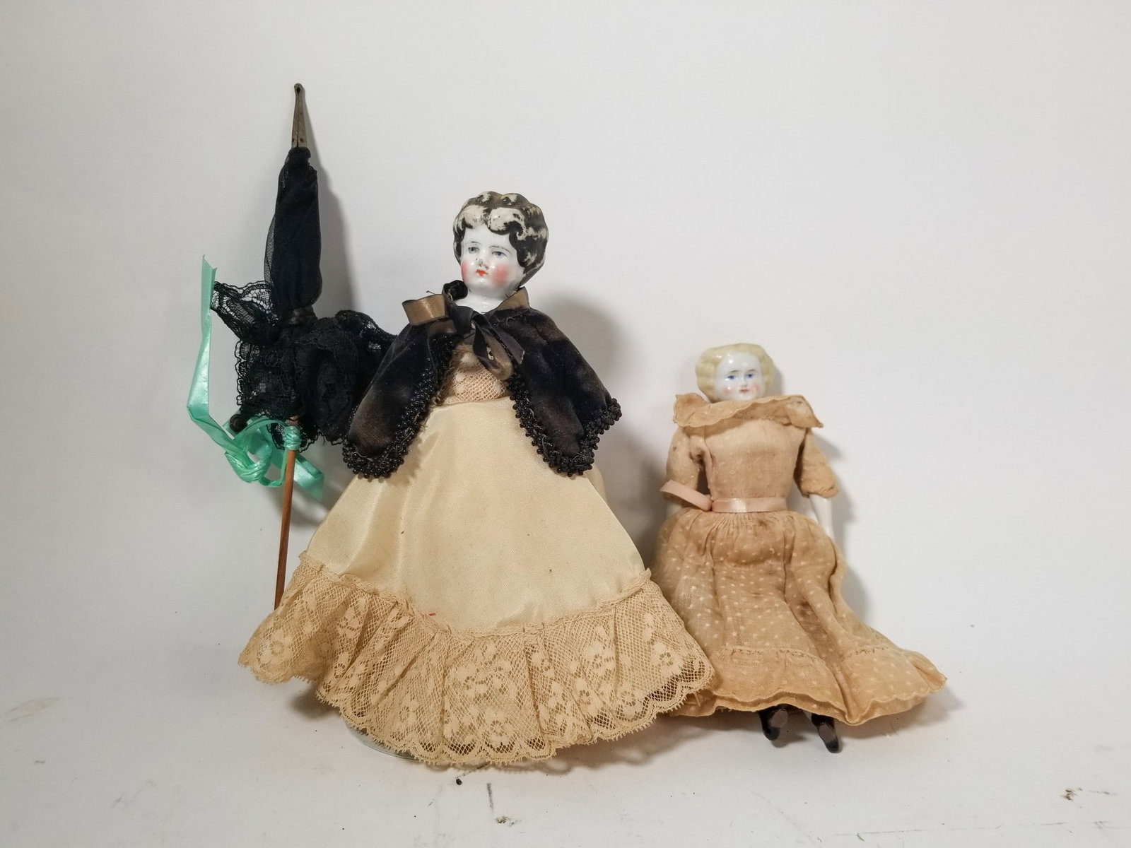 Pair of Antique Porcelain China Head Dolls: Pair of Antique Porcelain China Head Dolls Size 8" H Literature Brooks Auction – Online Auction Terms & Conditions Contact: (856) 694-2960 | info@brooks.auction READ BEFORE YOU BID: We want you