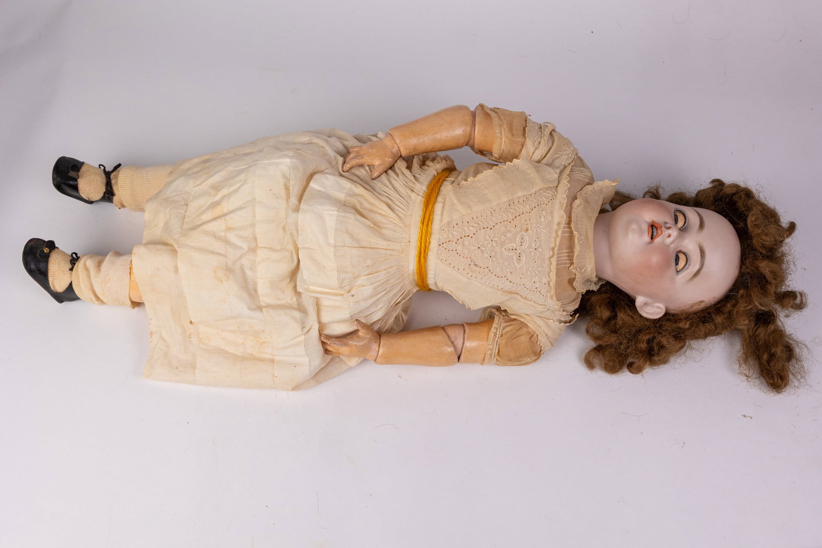 Simon & Halbig 28" Bisque Doll: Bisque head, composition arms, legs, and body. Marked SH 1079 Size 28" Literature Brooks Auction – Online Auction Terms & Conditions Contact: (856) 694-2960 | info@brooks.auction READ BEFORE