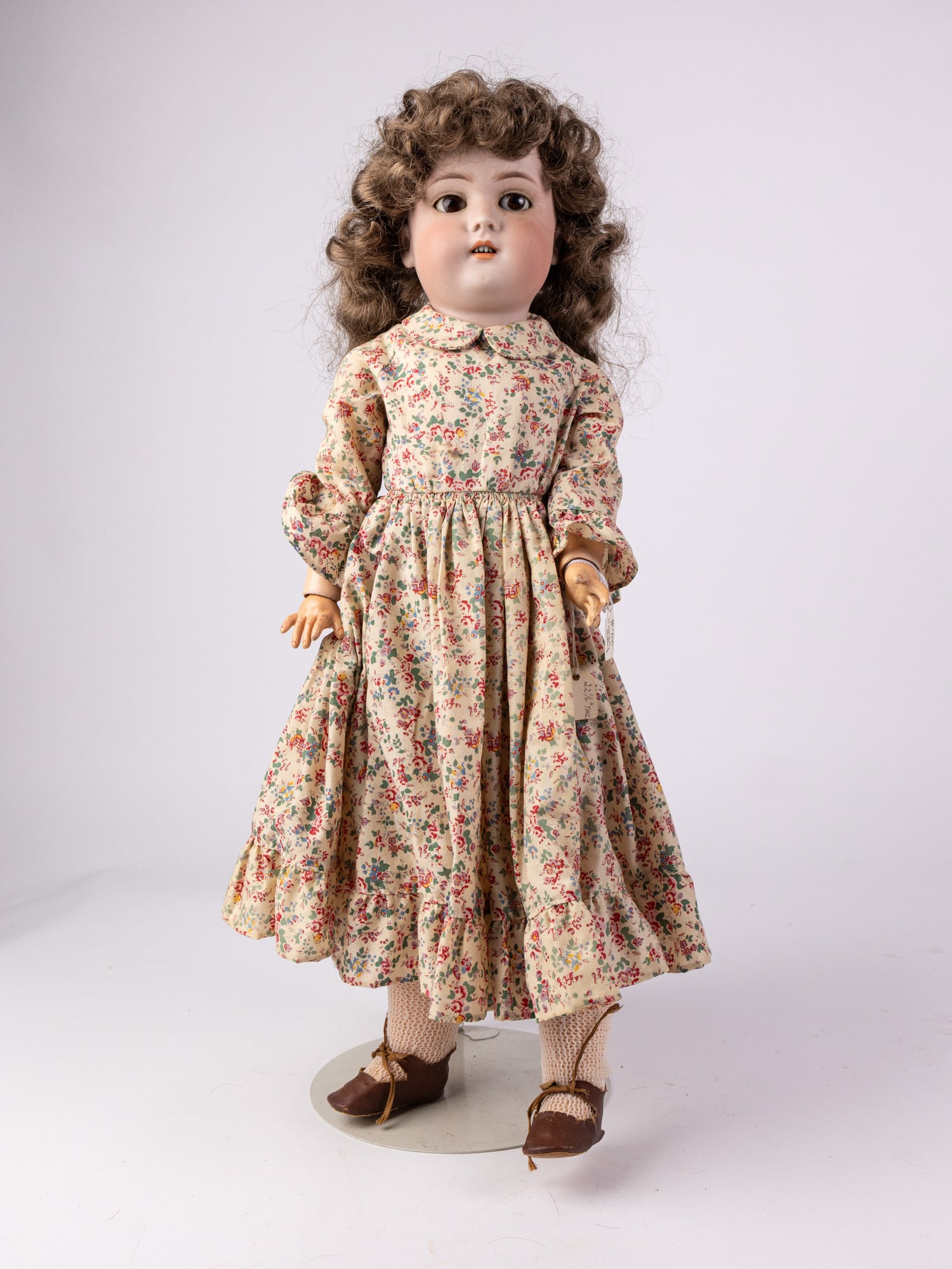 Simon & Halbig Bisque Doll: Bisque head, composite arms, legs, and body. Marked Simon & Halbig C B on back of neck. Size 22" Literature Brooks Auction – Online Auction Terms & Conditions Contact: (856) 694-2960 | info@bro