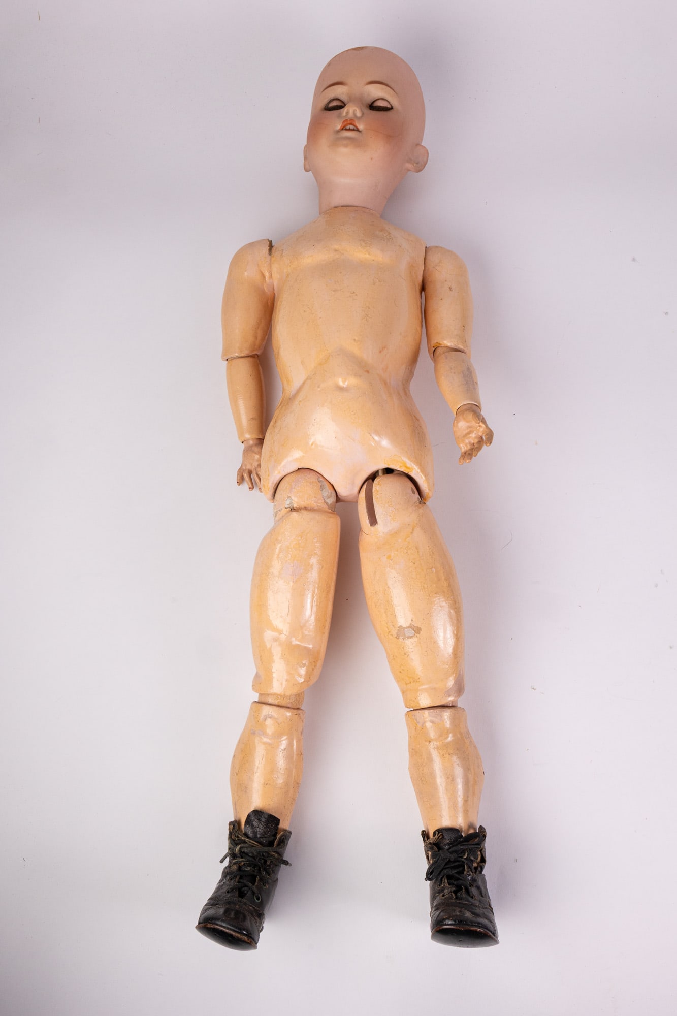 Antique Bisque Made in Germany 20" Doll: Marked N70, H on back of neck. No clothes/hair. Composition body. Size 27" Literature Brooks Auction – Online Auction Terms & Conditions Contact: (856) 694-2960 | info@brooks.auction READ