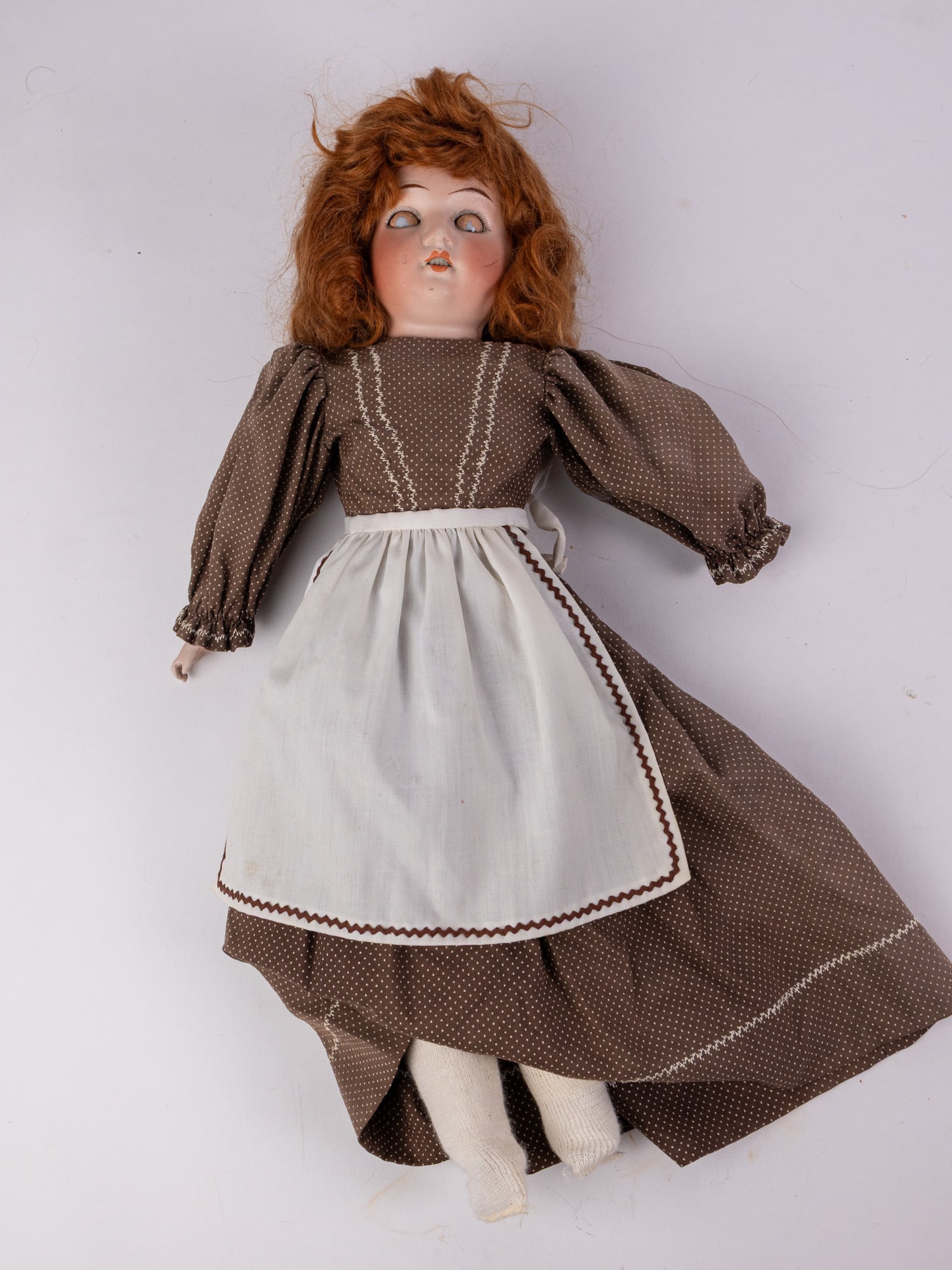 Antique German Bisque 18" Doll: Leather jointed body and brown sleep eyes Size 18" H Literature Brooks Auction – Online Auction Terms & Conditions Contact: (856) 694-2960 | info@brooks.auction READ BEFORE YOU BID: We w