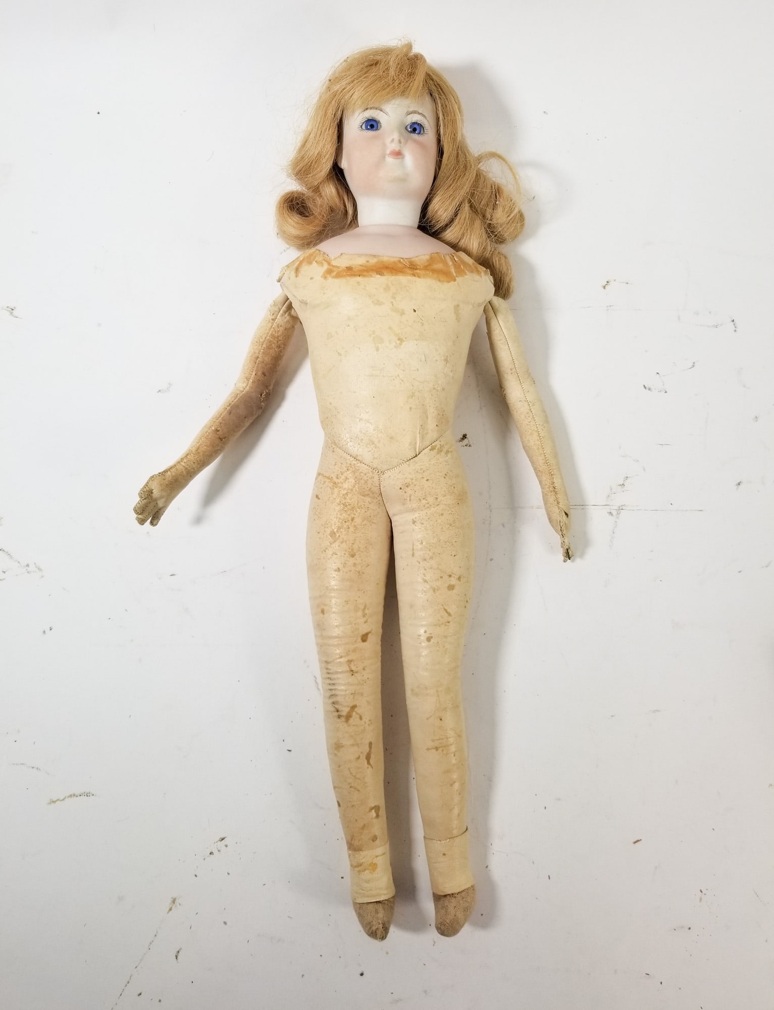 Antique Bisque Leather Body Doll w/ Blue Glass Eyes: Antique Bisque Leather Body Doll w/ Blue Glass Eyes Size 17" H Literature Brooks Auction – Online Auction Terms & Conditions Contact: (856) 694-2960 | info@brooks.auction READ BEFORE YOU BID