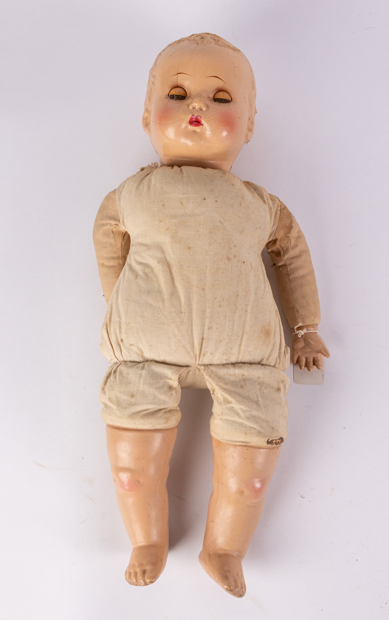 Early 20th Century Composition Baby Doll: Composition head , blue sleep eyes, painted lower lashes, applied upper lashes, feathered brows, composition hands, legs & cloth torso body Size 19" Literature Brooks Auction – Online Auction Te