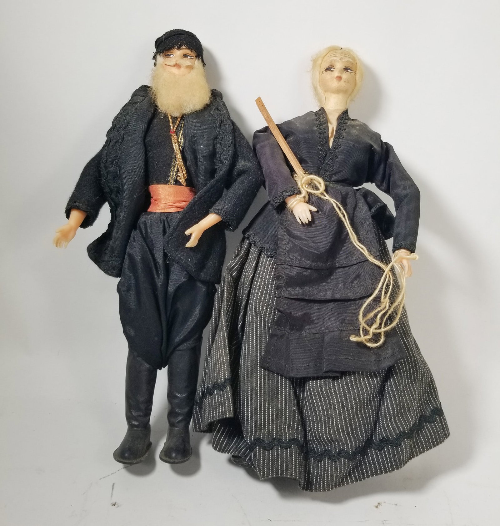 Pair of Vintage Cretan Folk Dolls in Traditional Greek Attire: Pair of Vintage Cretan Folk Dolls in Traditional Greek Attire Size 13" H Literature Brooks Auction – Online Auction Terms & Conditions Contact: (856) 694-2960 | info@brooks.auction READ BEFO