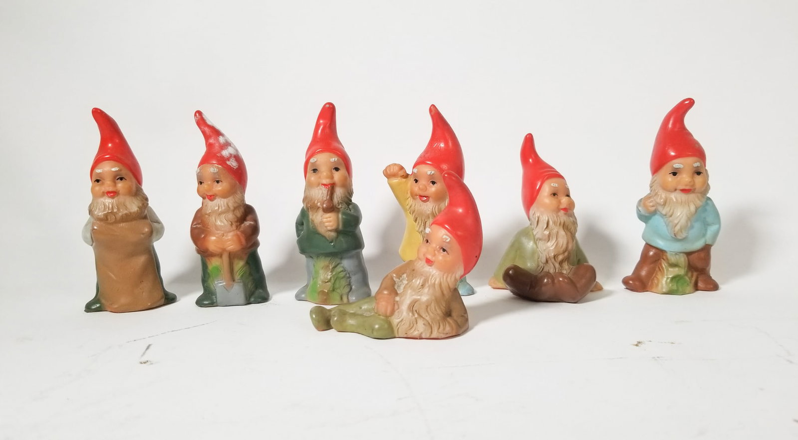 Set of Seven "Heissner" Style Gnomes Made In West Germany: Set of Seven "Heissner" Style Gnomes Made In West Germany Size 4" H Literature Brooks Auction – Online Auction Terms & Conditions Contact: (856) 694-2960 | info@brooks.auction READ BEFORE YOU