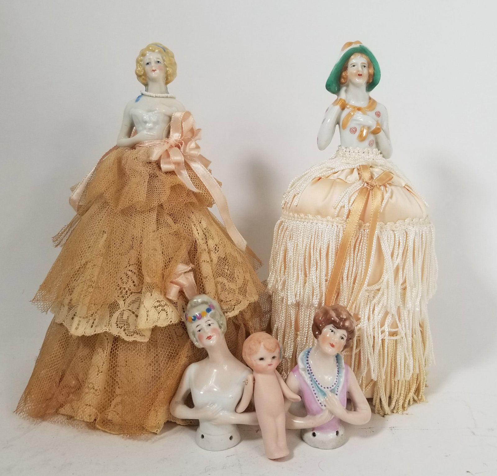Vintage Porcelain Pin Cushion Dolls: Vintage Porcelain Pin Cushion Dolls Size 7" x 12" x 12" Literature Brooks Auction – Online Auction Terms & Conditions Contact: (856) 694-2960 | info@brooks.auction READ BEFORE YOU BID: We want